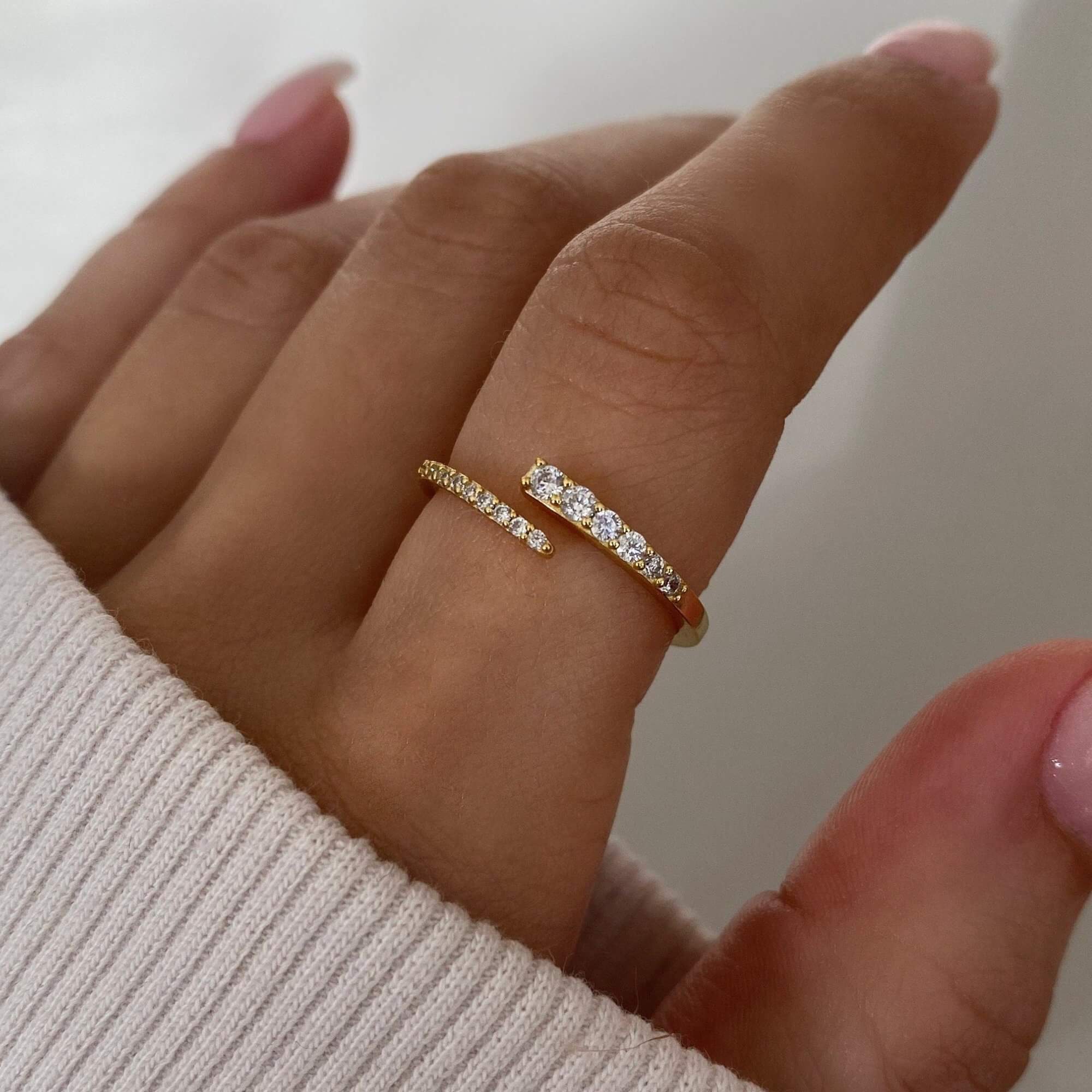 Close-up of the KimikoR 14K gold-plated wrap ring by Kampy Designs, highlighting its smooth curves and luxurious shine.