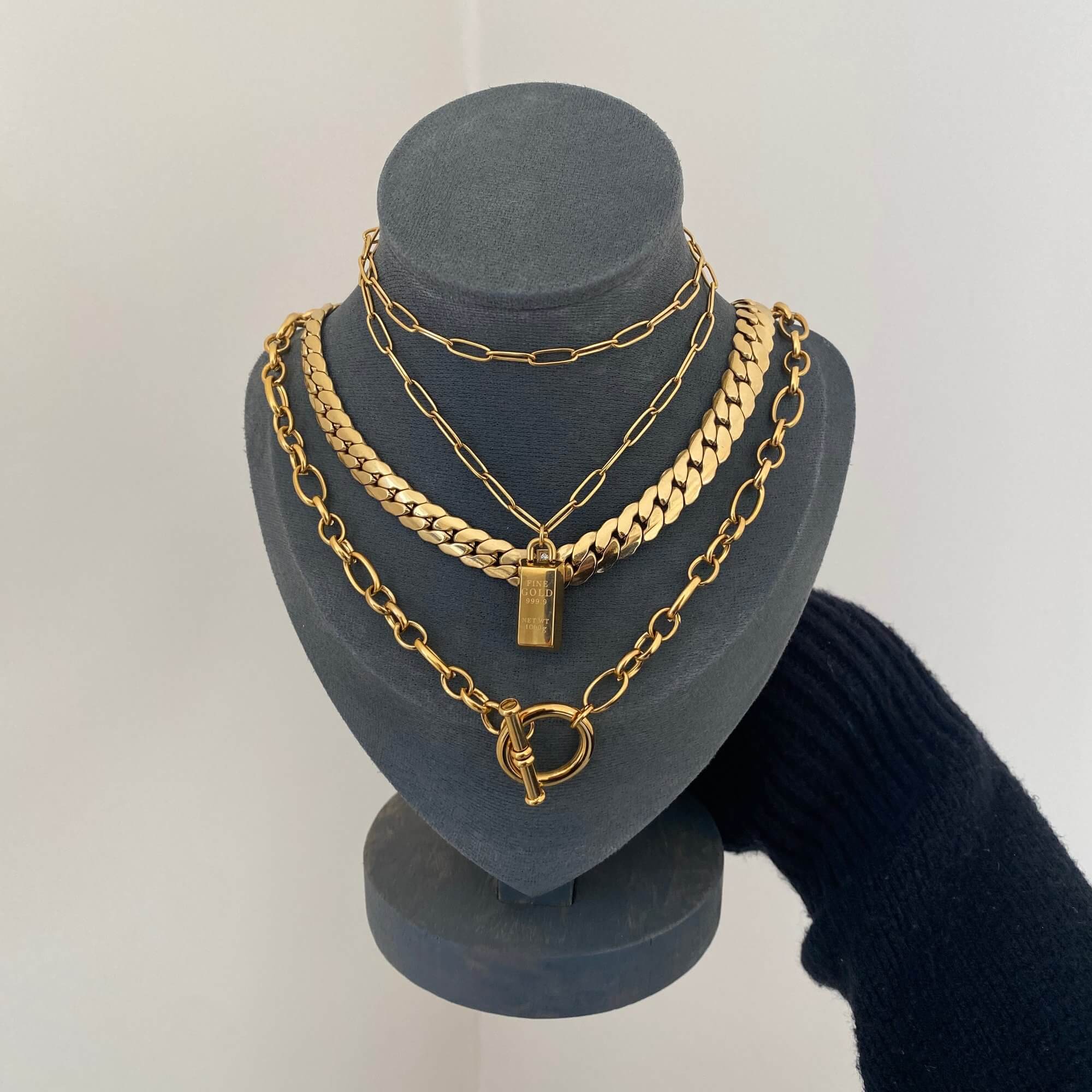 The KoldyN 18K gold bar pendant necklace by Kampy Designs, beautifully displayed to highlight its polished gold finish and minimalistic charm.