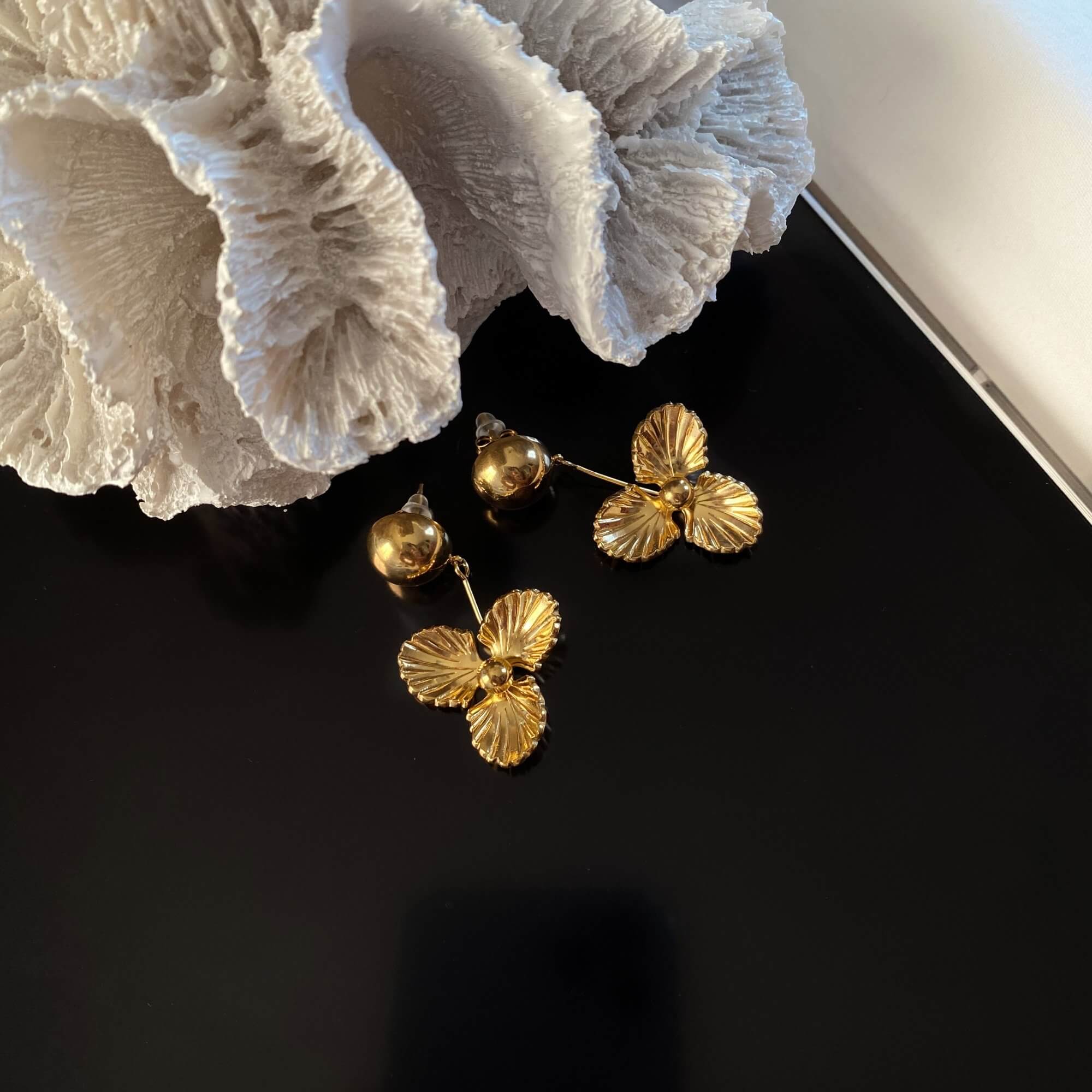 Front view of the KloverE 18K gold-plated bold clover drop earrings by Kampy Designs, showcasing their intricate clover-shaped design and luxurious gold finish.