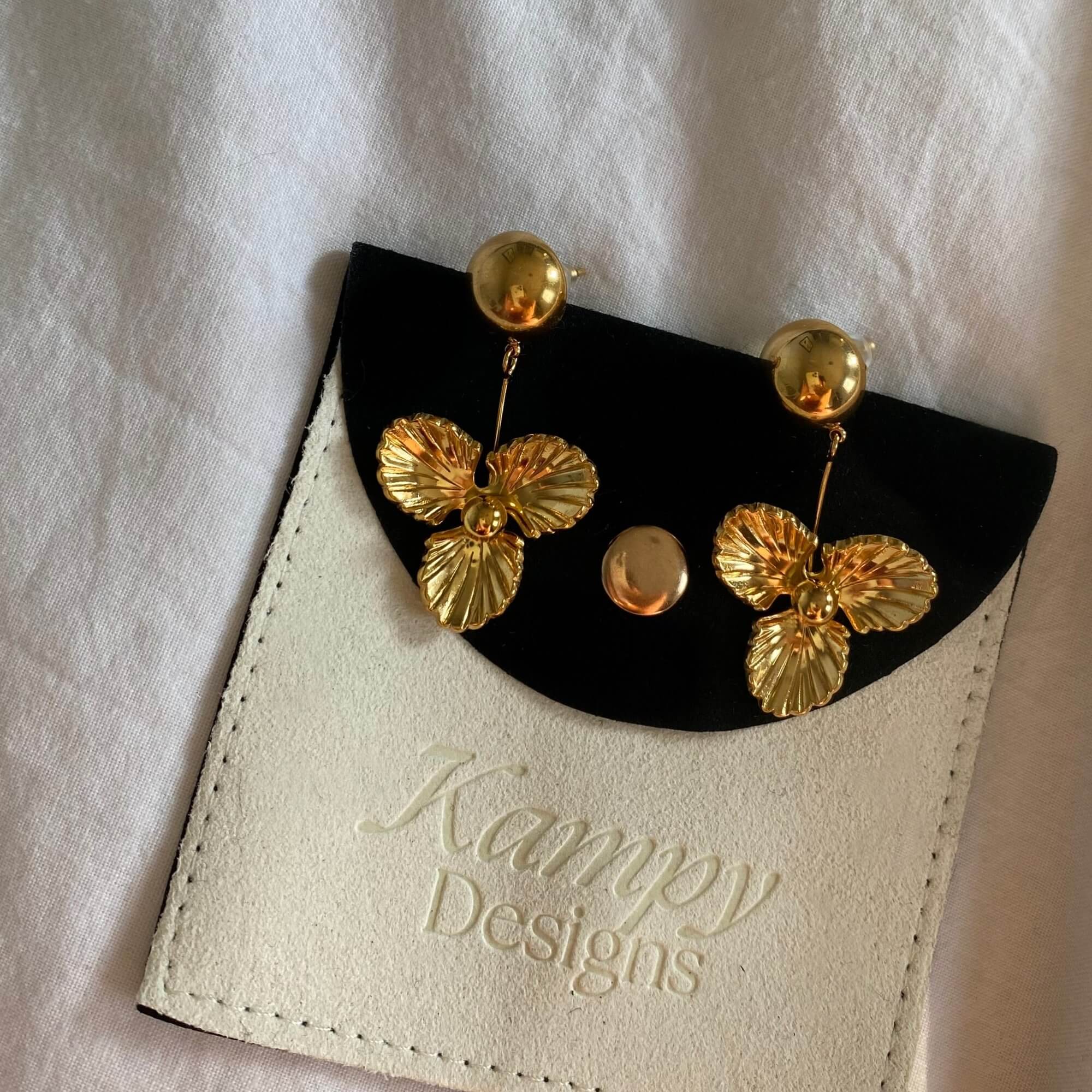 Top view of the KloverE 18K gold-plated bold clover drop earrings by Kampy Designs, displaying their delicate yet statement-making charm.