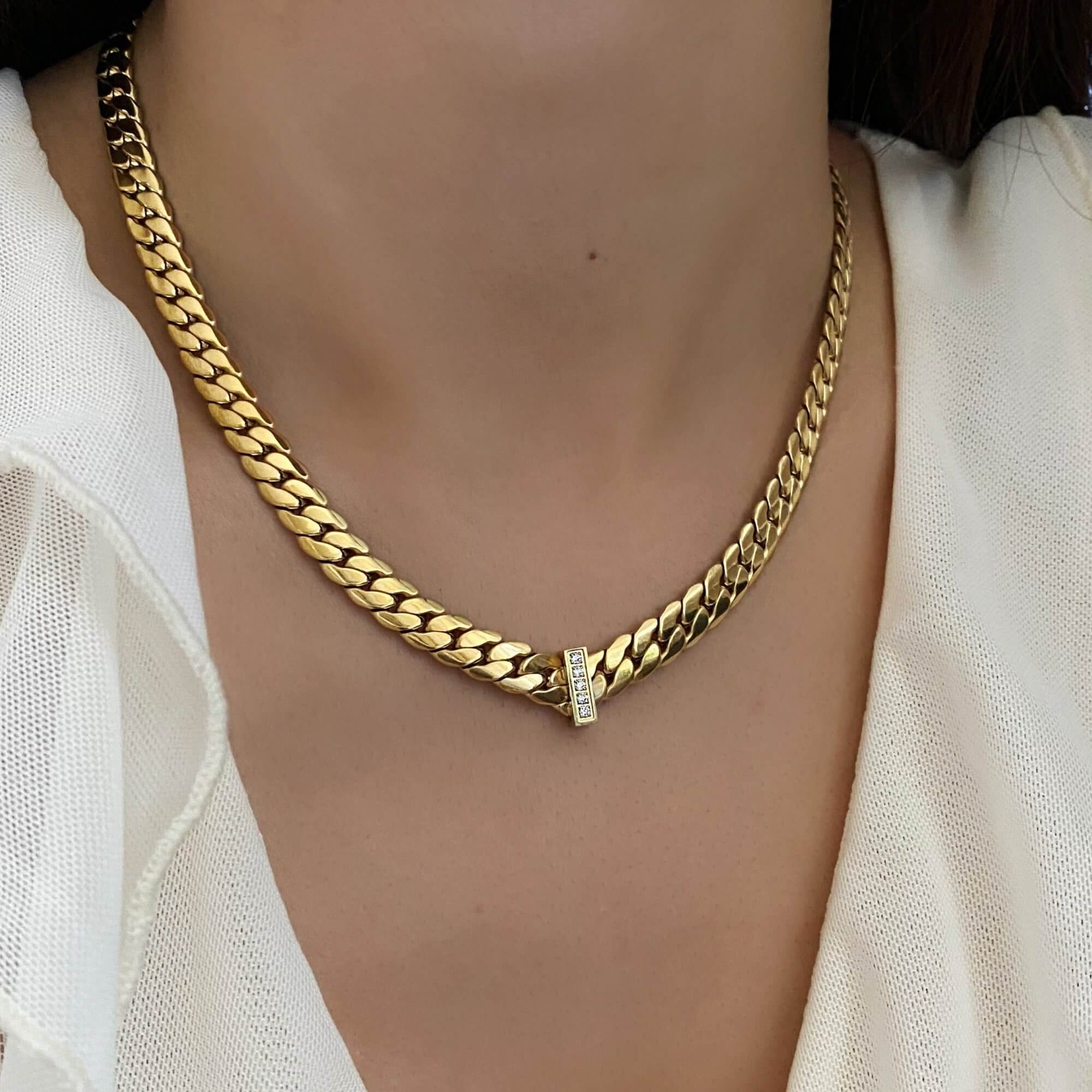 Angled view of the KeikoN 18K gold-plated bold CZ necklace by Kampy Designs, highlighting its luxurious gold-plated finish and dazzling stones.