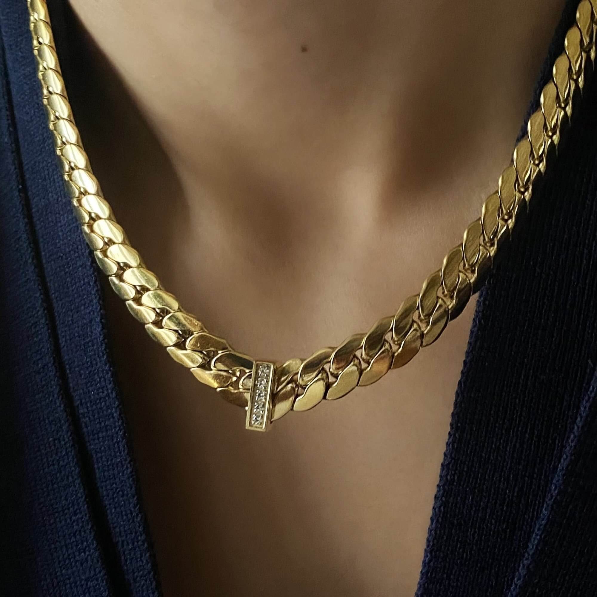 Close-up of the KeikoN 18K gold-plated bold CZ necklace by Kampy Designs, showcasing its intricate details and radiant cubic zirconia embellishments.