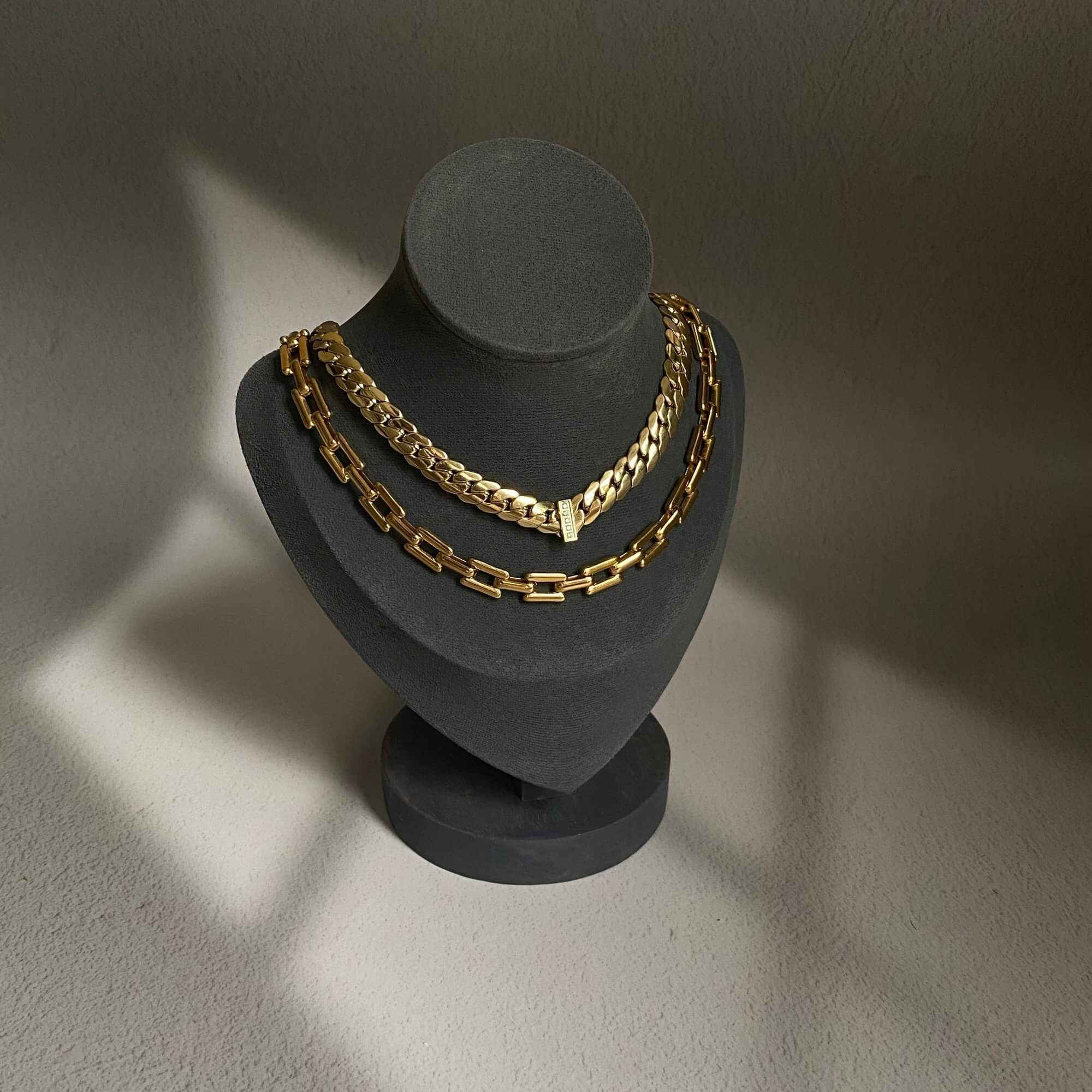 The KeikoN 18K gold-plated bold CZ necklace by Kampy Designs, beautifully displayed to showcase its exquisite design and shimmering cubic zirconia accents.