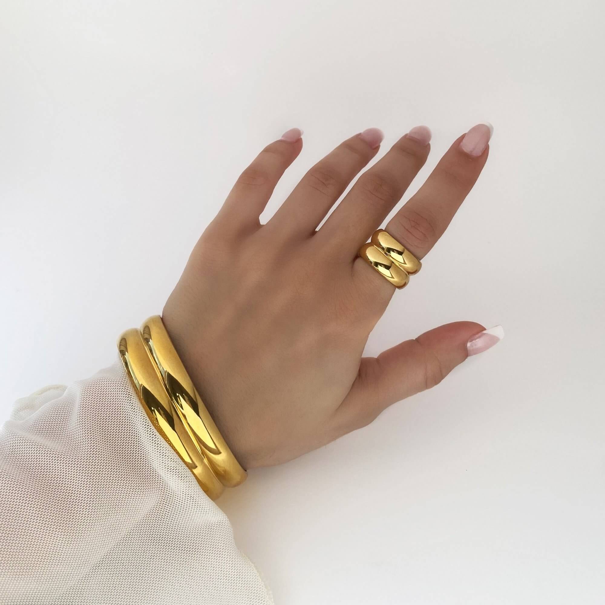 The KinkoR 18K gold-plated chunky bold ring by Kampy Designs, displayed as part of a set for a modern and sophisticated look.