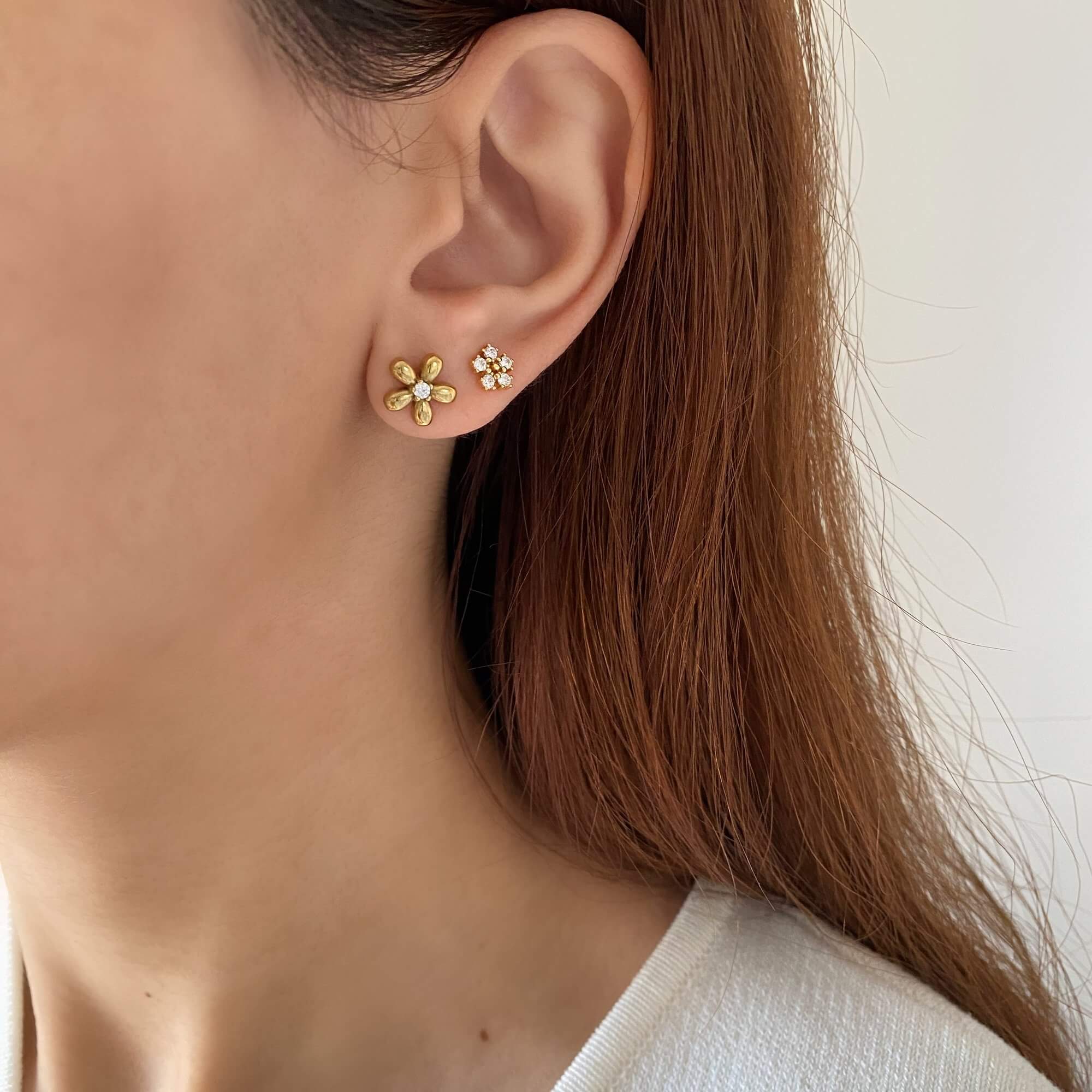 Close-up of the KayleyE 18K gold-plated CZ diamond flower stud earrings by Kampy Designs, sparkling with precision-cut cubic zirconia stones.
