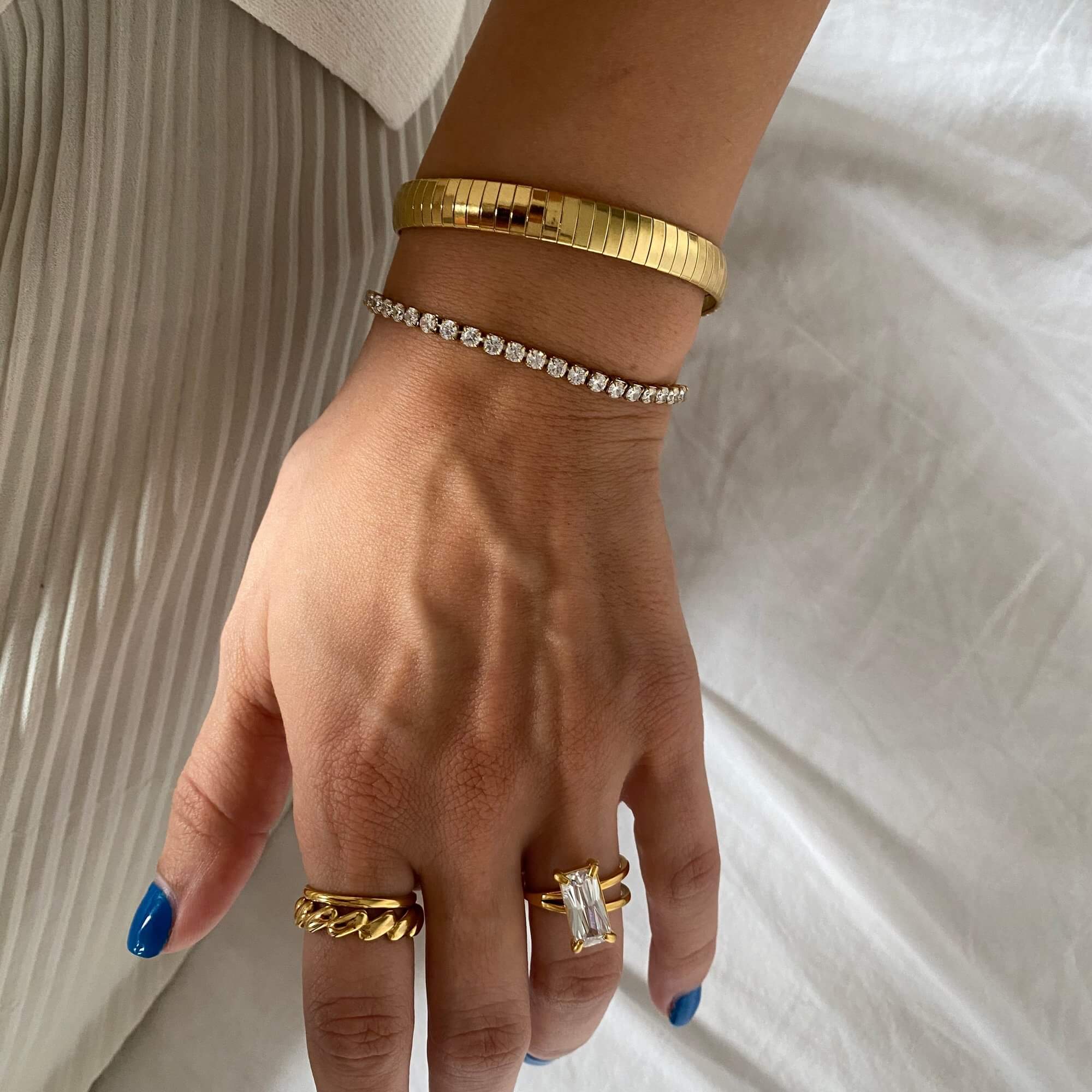 Stacked view of the KennisB 18K gold-plated CZ tennis bracelet by Kampy Designs, paired with other bracelets for a layered and luxurious look.