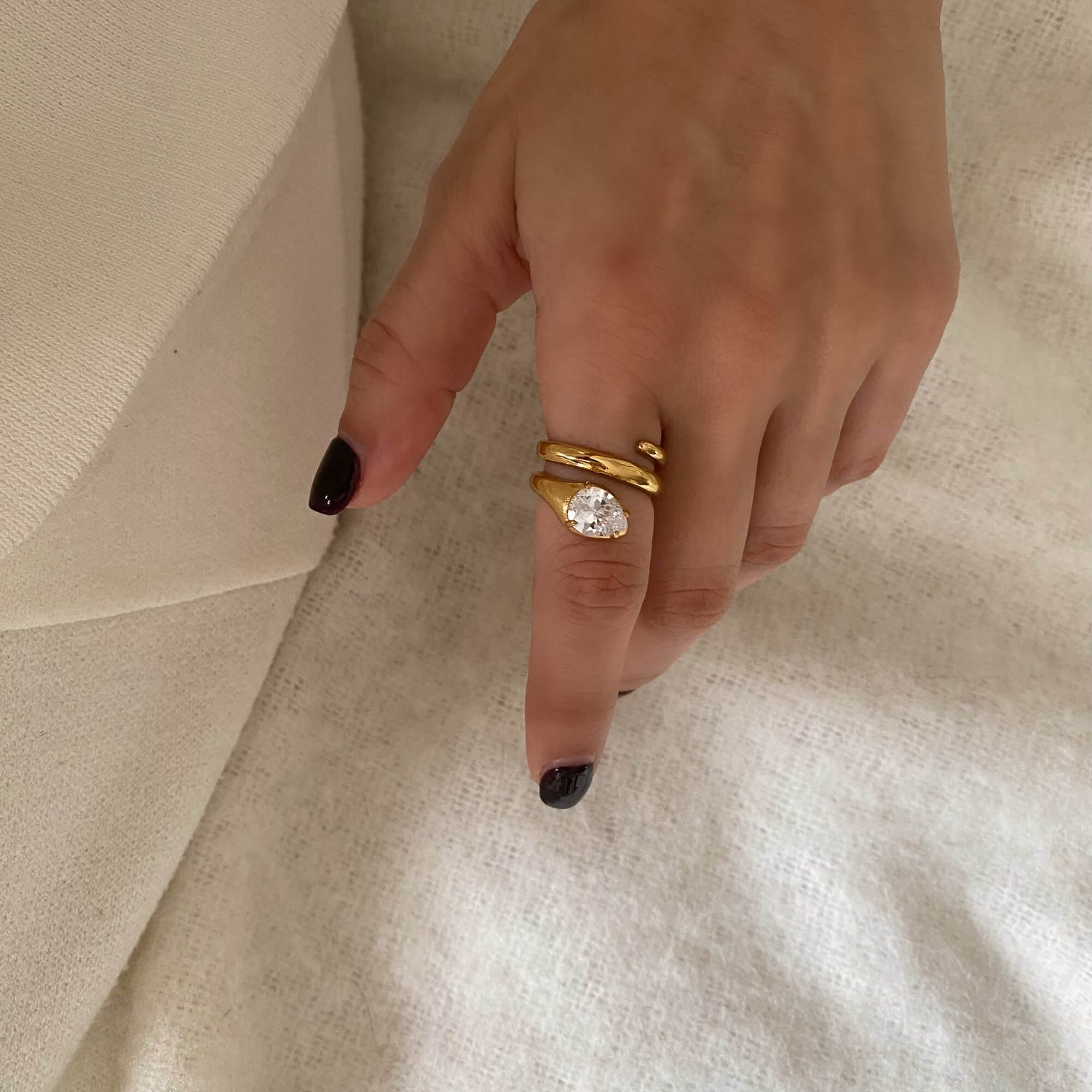 Angled view of the KinderR 18K gold-plated diamond serpent ring by Kampy Designs, highlighting its elegant snake-inspired design with sparkling diamond accents.