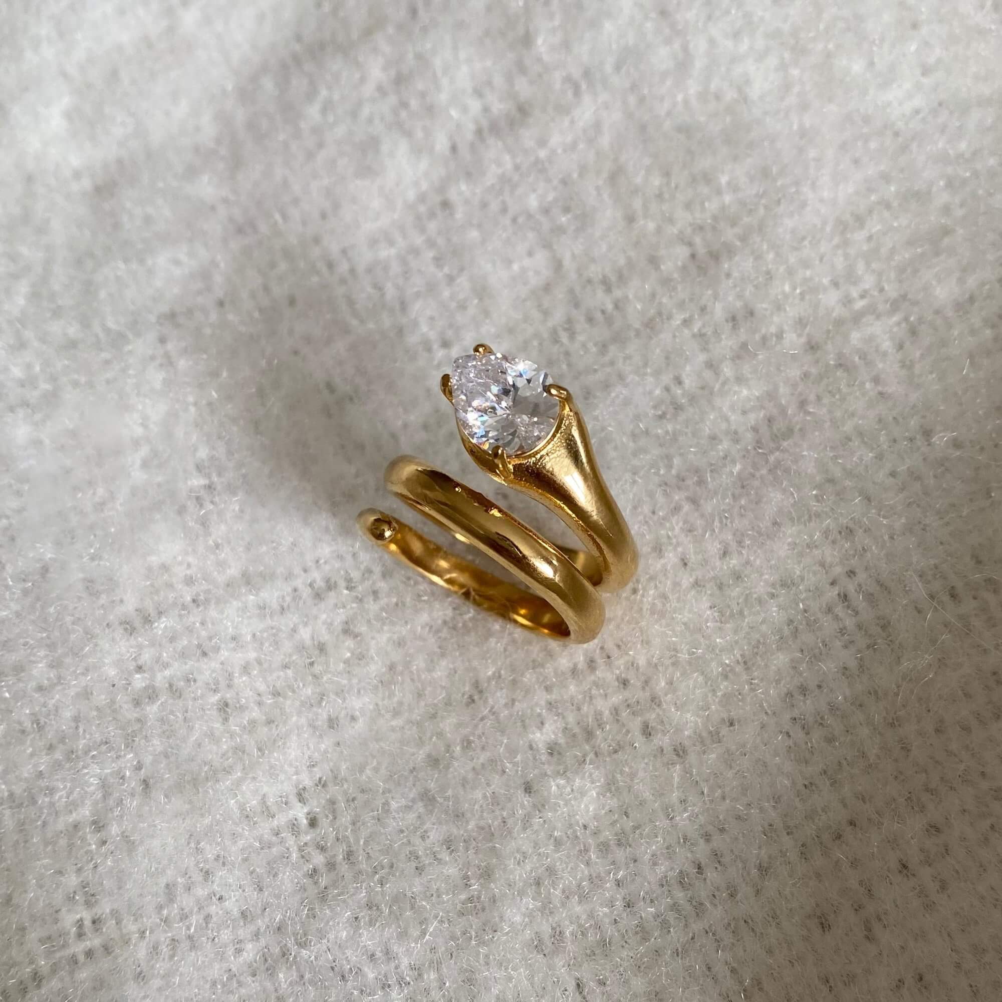 Side view of the KinderR 18K gold-plated diamond serpent ring by Kampy Designs, emphasizing its coiled shape and luxurious gold finish.