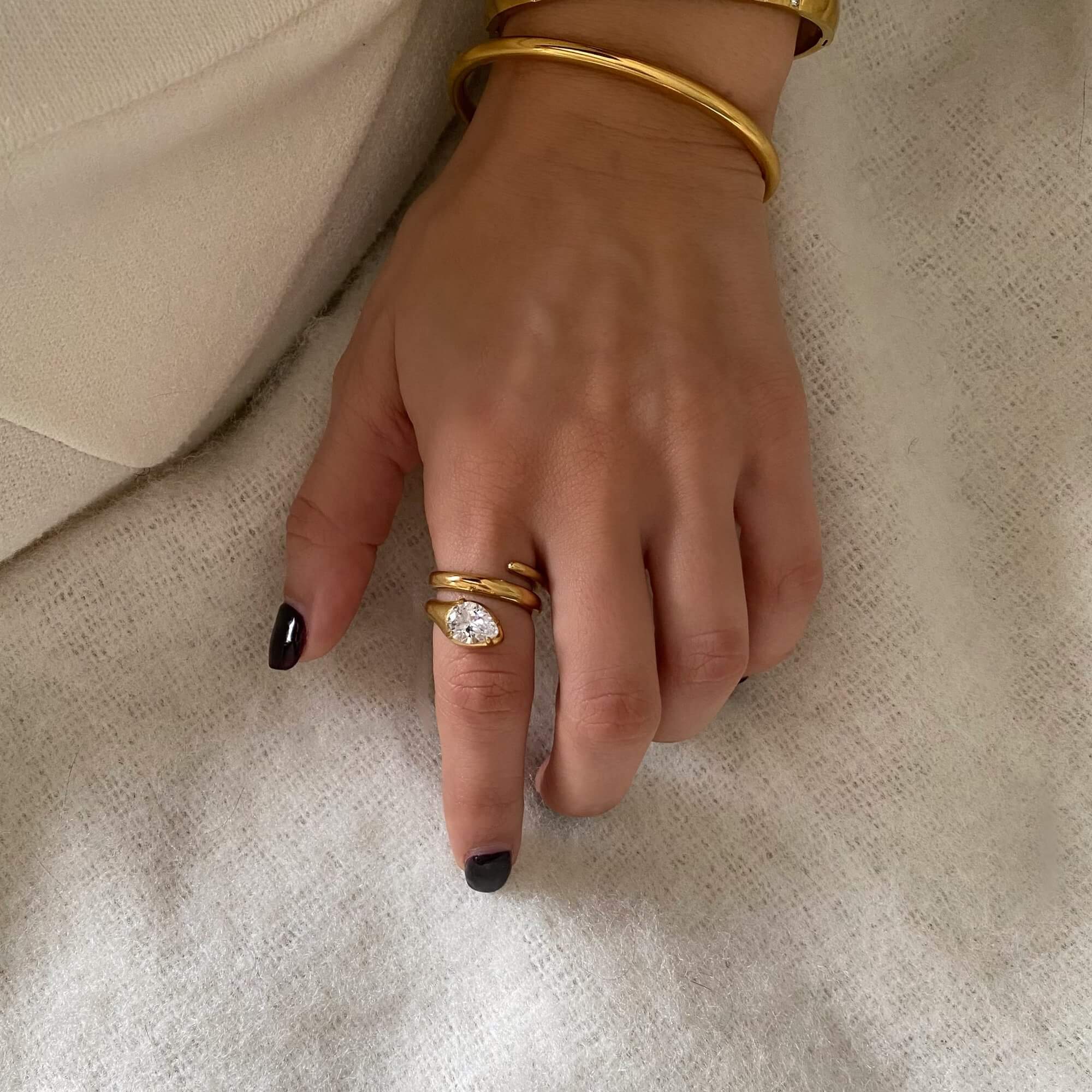 Stacked view of the KinderR 18K gold-plated diamond serpent ring by Kampy Designs, beautifully layered for an eye-catching look.