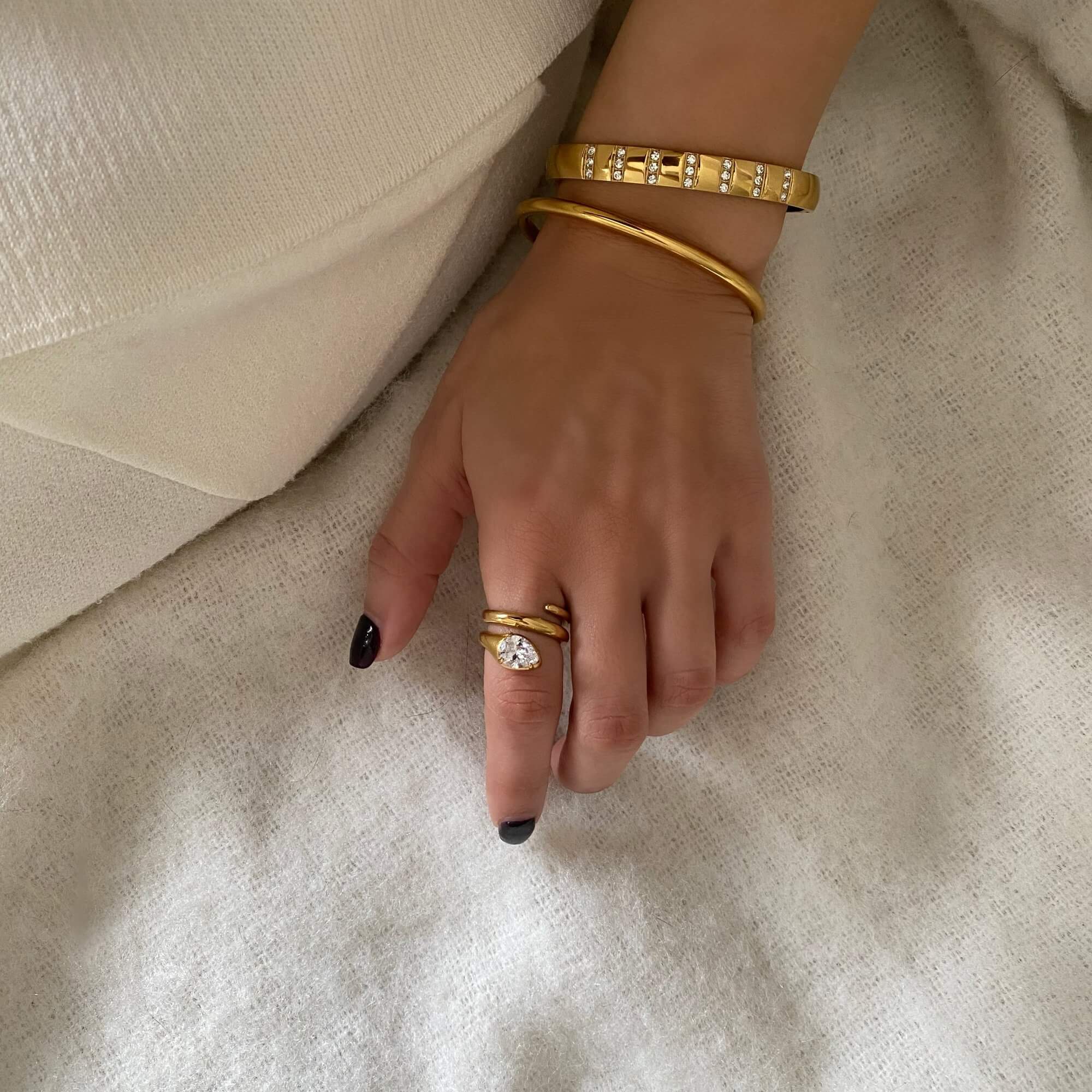 The KinderR 18K gold-plated diamond serpent ring by Kampy Designs, styled for a bold and elegant jewelry statement.