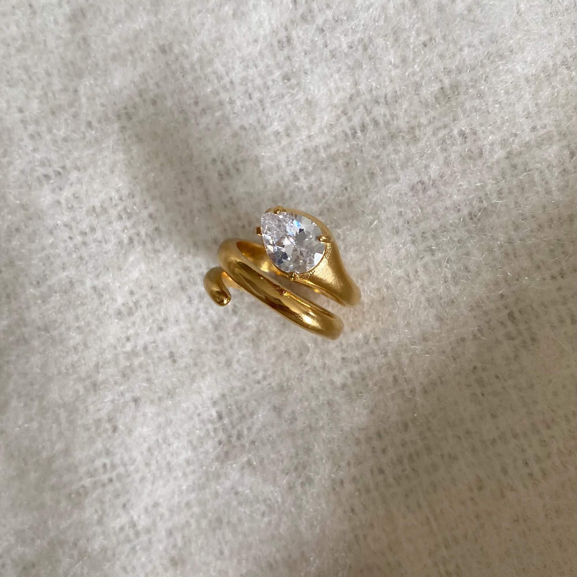 Top-down view of the KinderR 18K gold-plated diamond serpent ring by Kampy Designs, highlighting its intricate detailing and diamond embellishments.