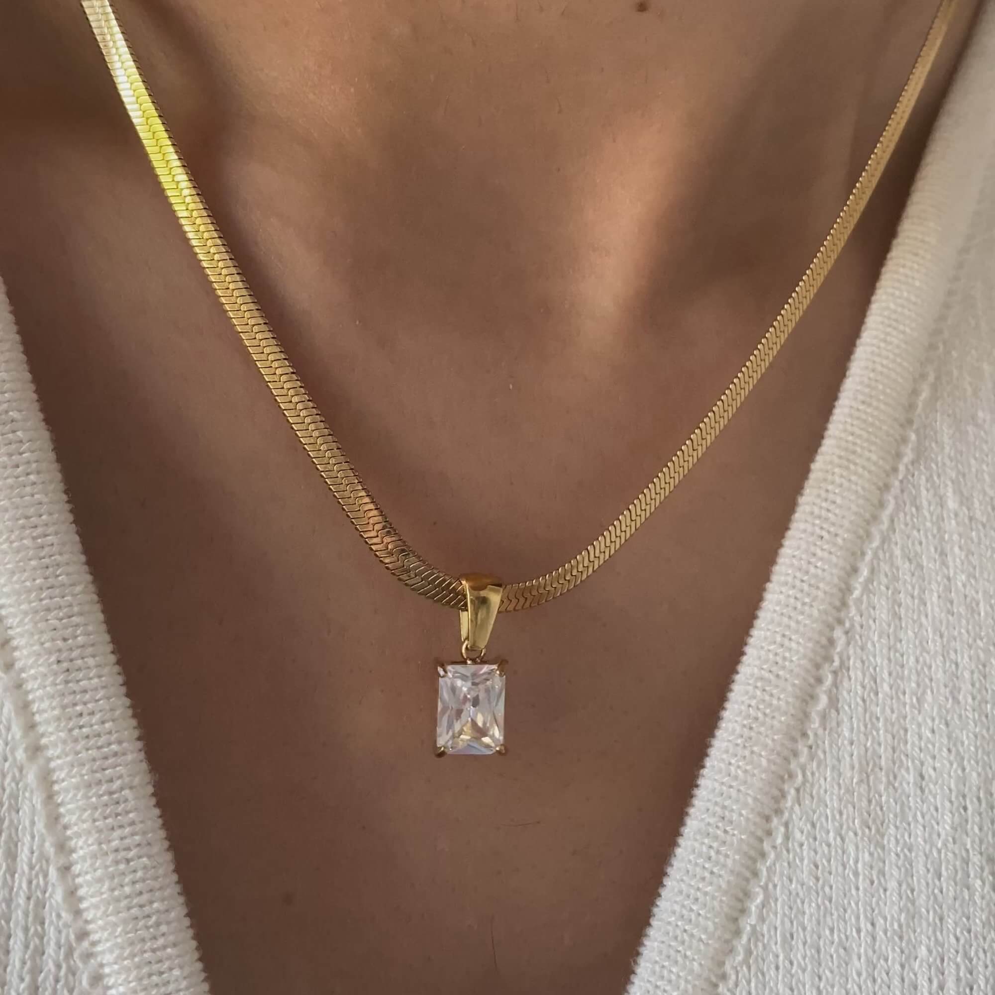 Side view of the KonokoN 18K gold-plated emerald-cut CZ pendant necklace by Kampy Designs, highlighting its precision-cut gemstone and delicate gold setting.