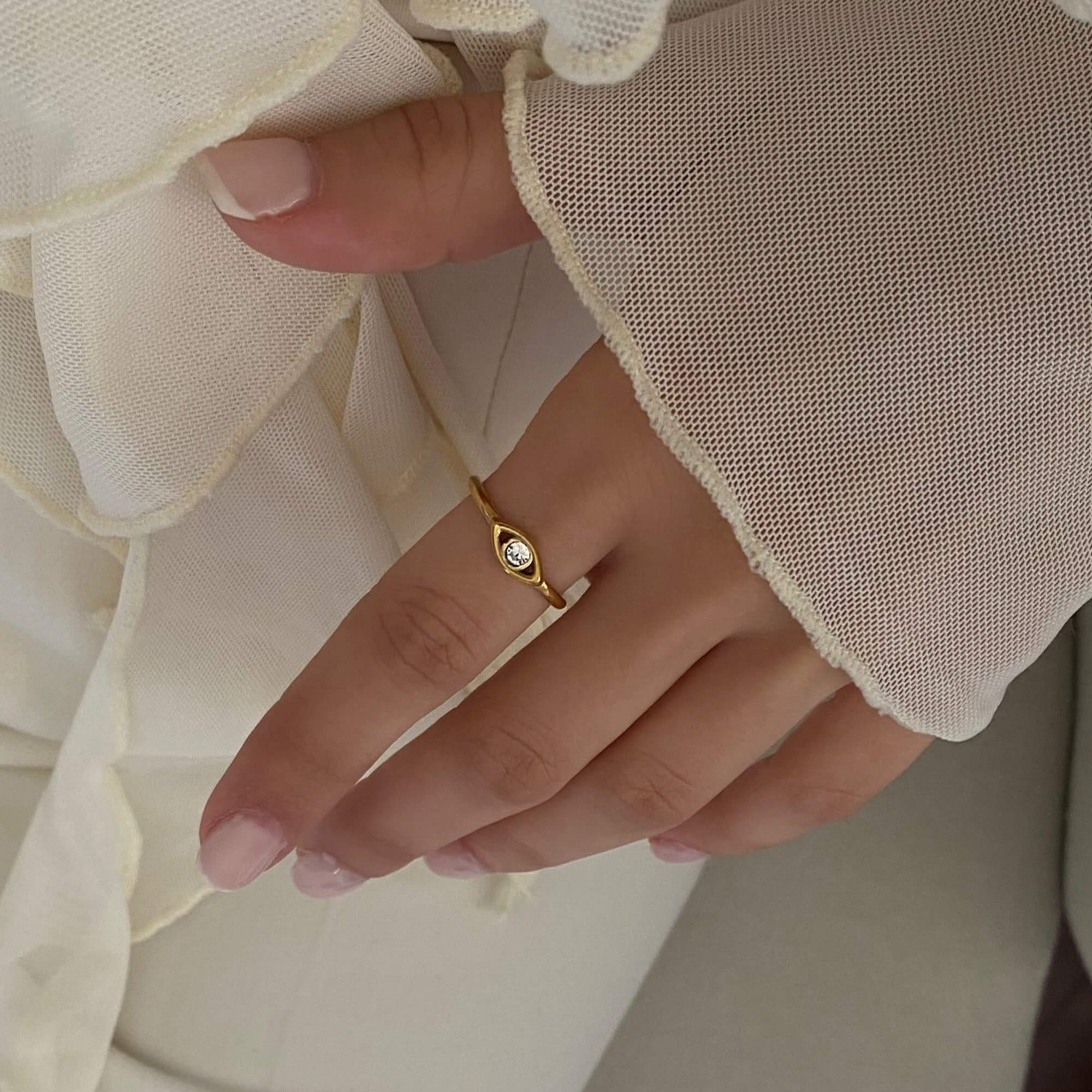 The KanakaR 18K gold-plated evil eye stone ring by Kampy Designs, beautifully worn as a statement piece of protection and sophistication.