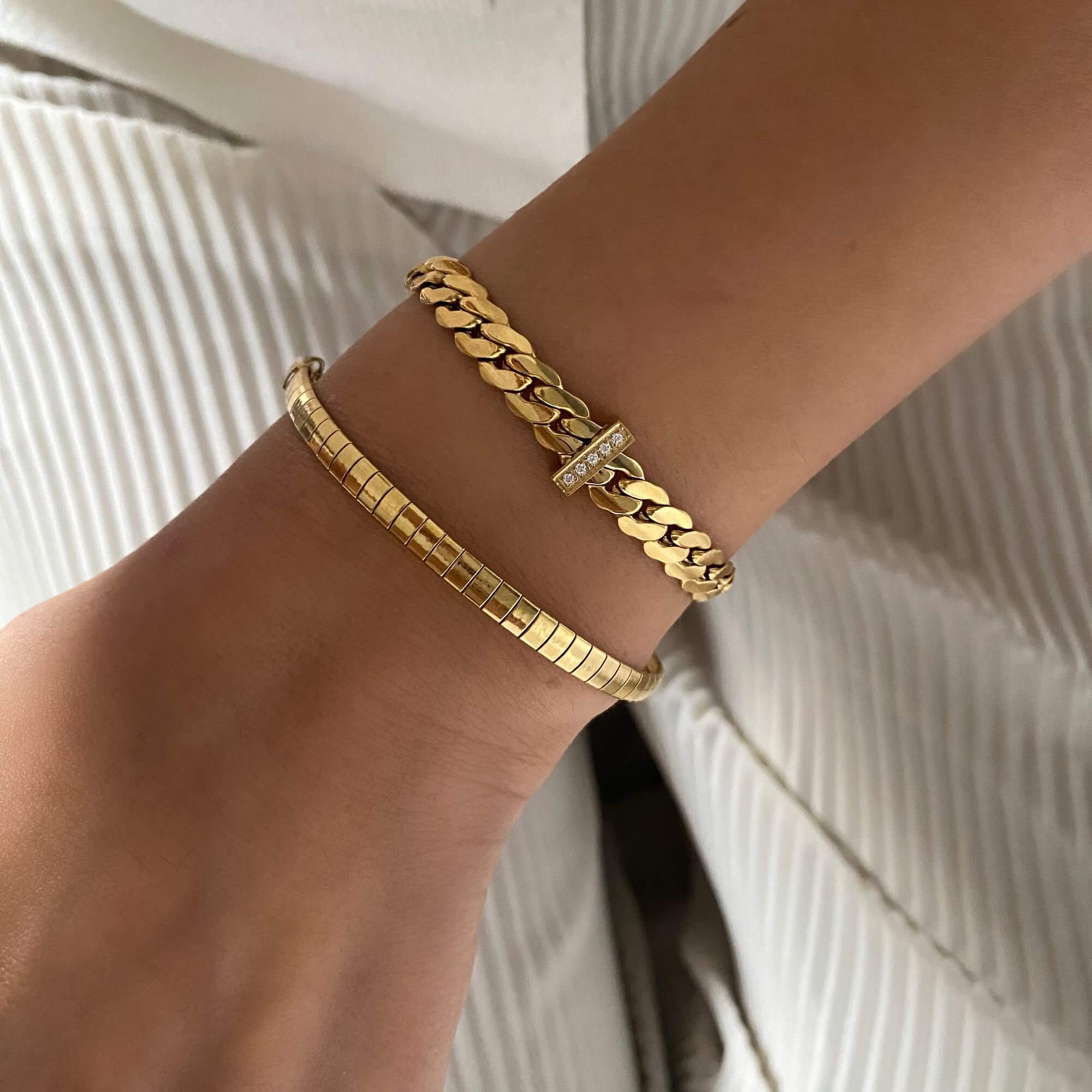 The KenyaB 18K gold-plated flat gold bracelet (4mm) by Kampy Designs, styled for a delicate and understated jewelry look.