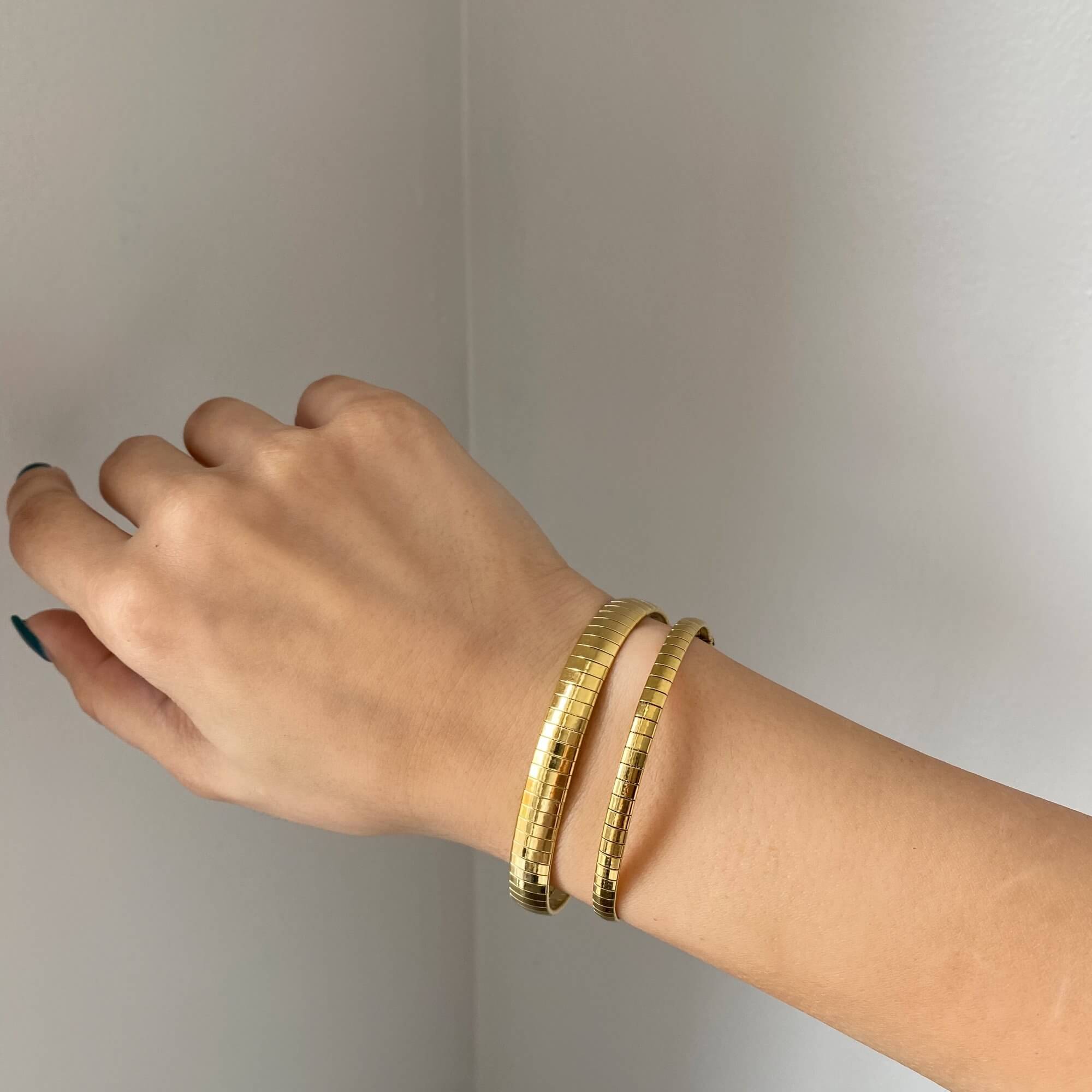 Stacked view of the KenyaB 18K gold-plated flat gold bracelet (7mm & 4mm) by Kampy Designs, layered for a chic and bold style.