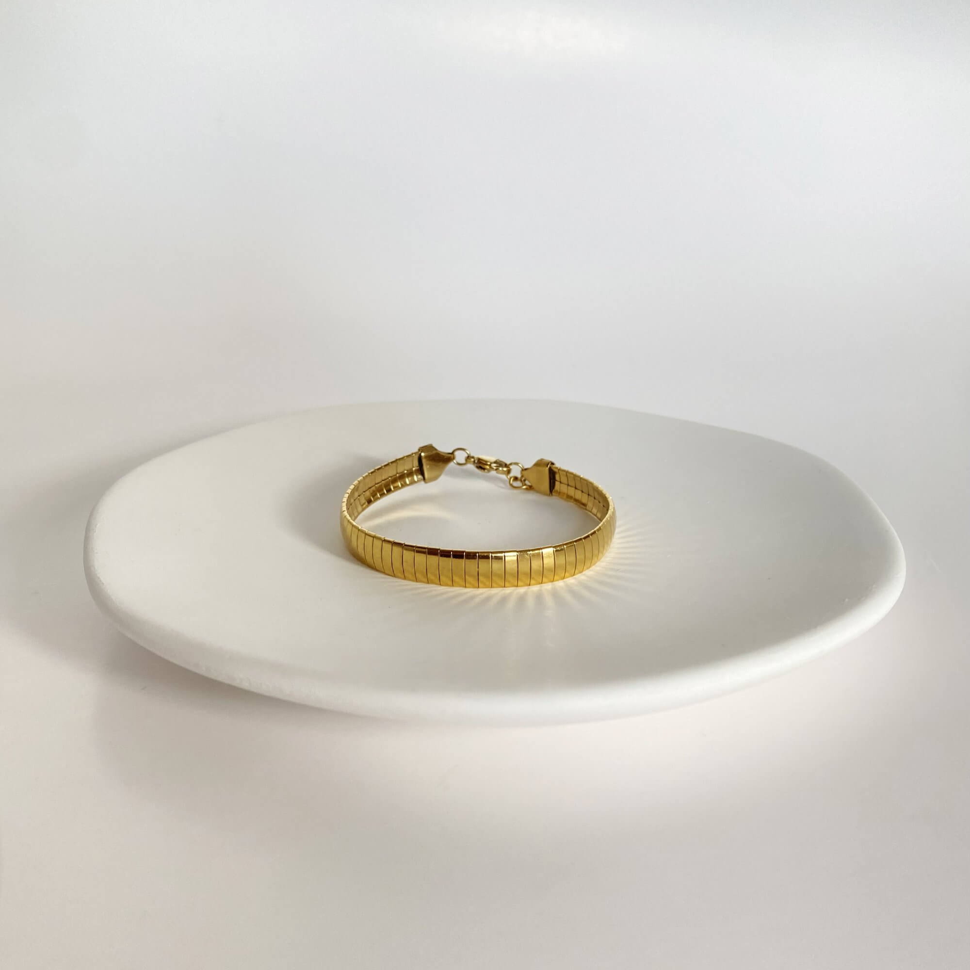 Front view of the KenyaB 18K gold-plated flat gold bracelet (7mm) by Kampy Designs, displaying its modern and refined structure.