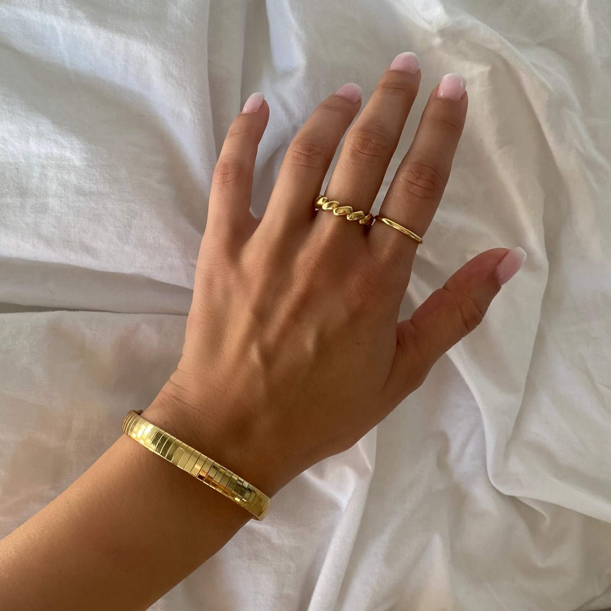 Top view of the KenyaB 18K gold-plated flat gold bracelet (7mm) by Kampy Designs, showcasing its high-shine finish and smooth edges.