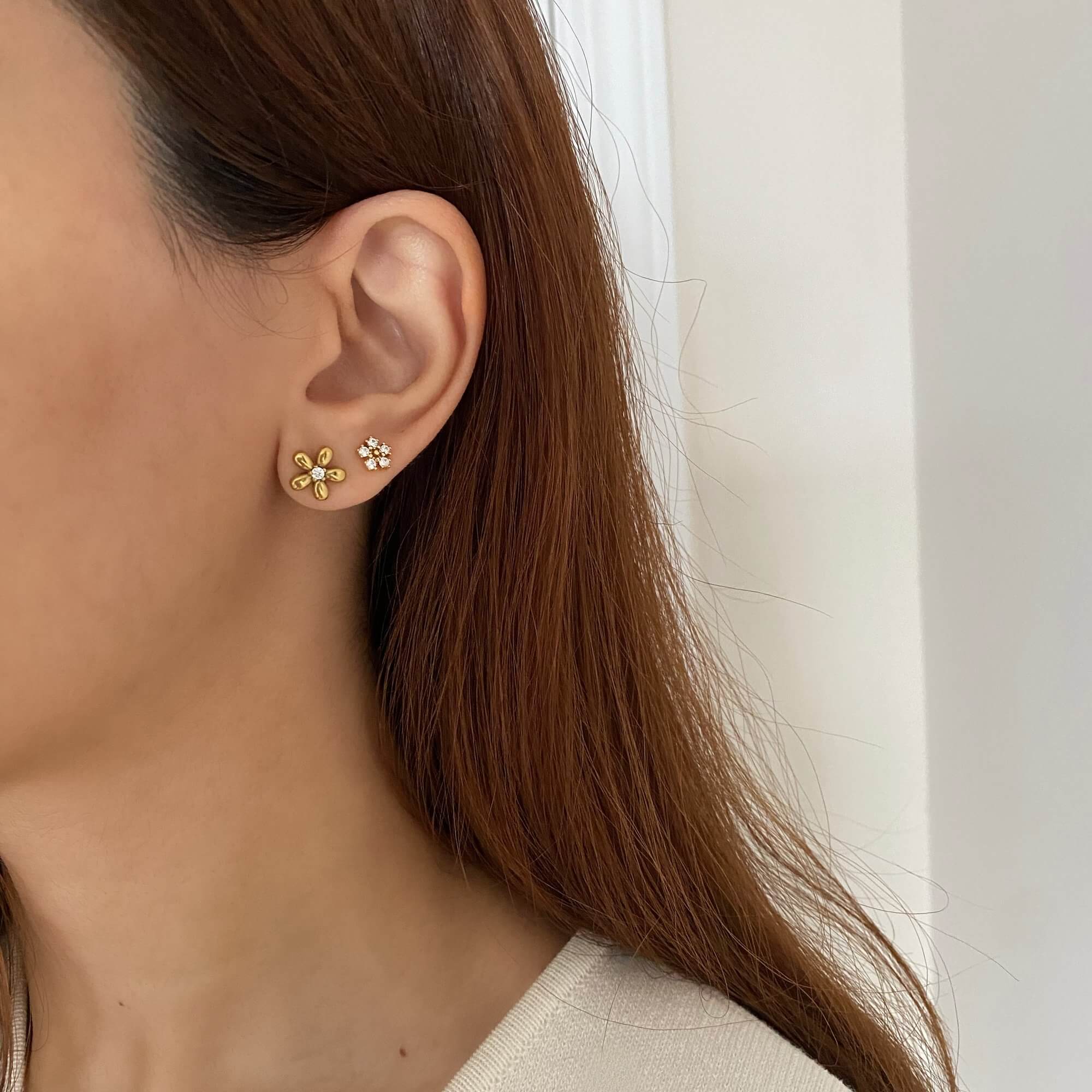 Close-up of the KayleyE 18K gold-plated CZ diamond flower stud earrings by Kampy Designs, sparkling with precision-cut cubic zirconia stones.