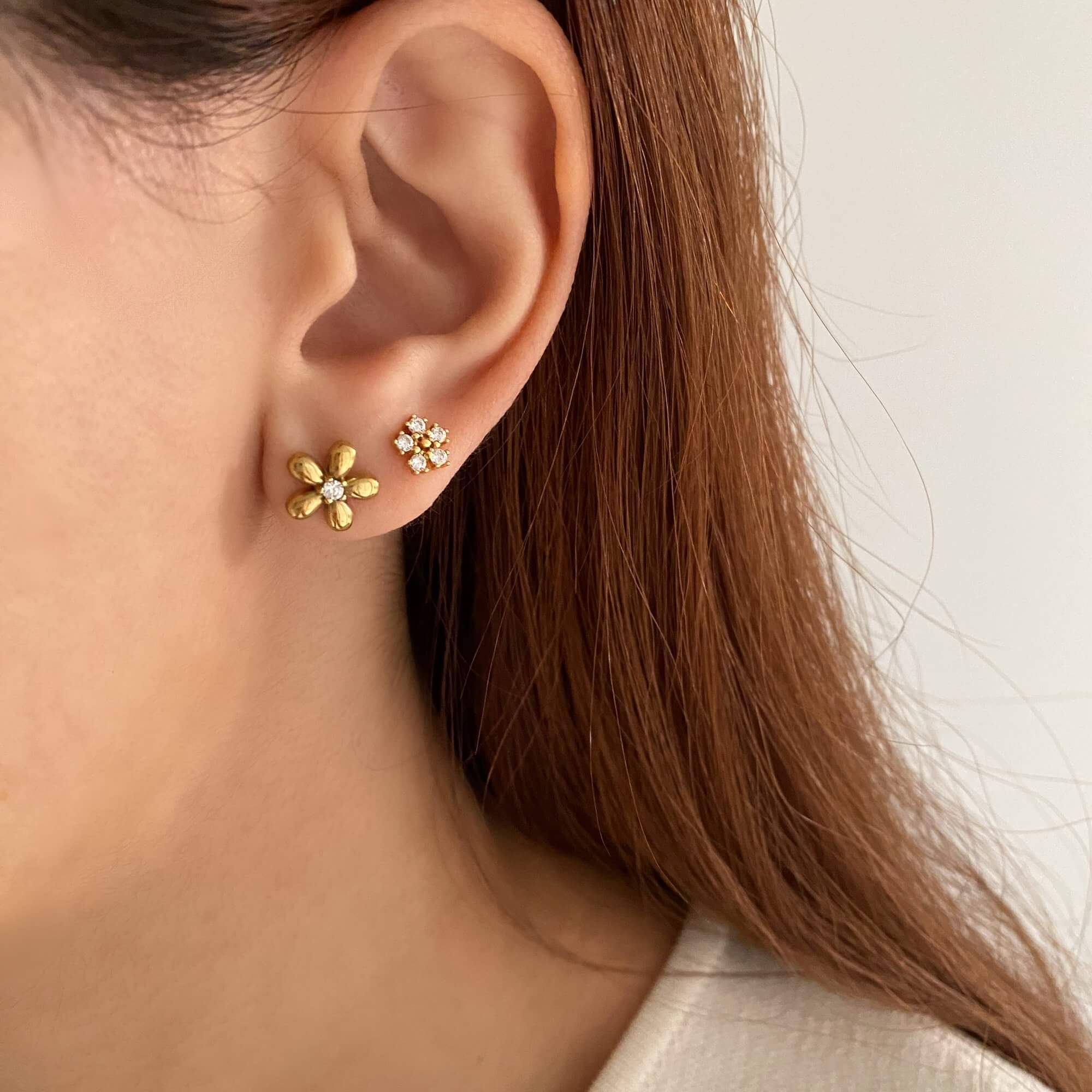 Stacked view of the KayleyE 18K gold-plated flower stud earring set by Kampy Designs, featuring both gold and CZ diamond variations.