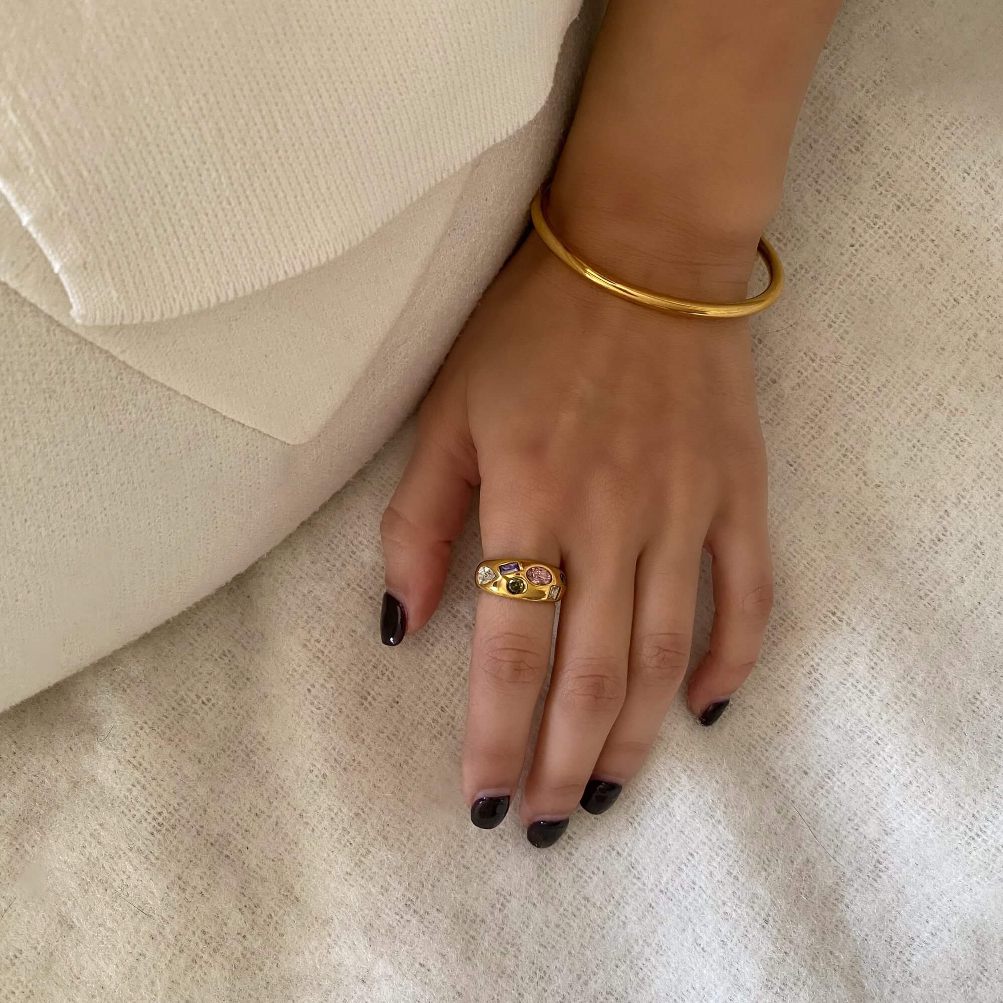 The KemmaR 18K gold-plated gemstone dome ring by Kampy Designs, styled to complement a modern and sophisticated jewelry look.