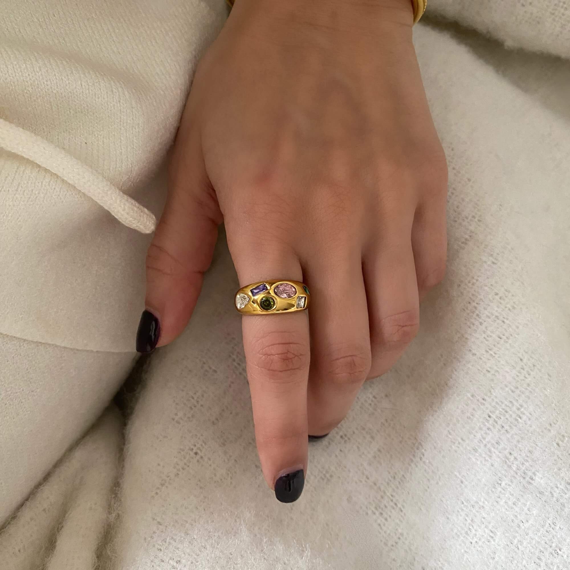 Close-up of the KemmaR 18K gold-plated gemstone dome ring by Kampy Designs, worn on a finger, showcasing its striking elegance.