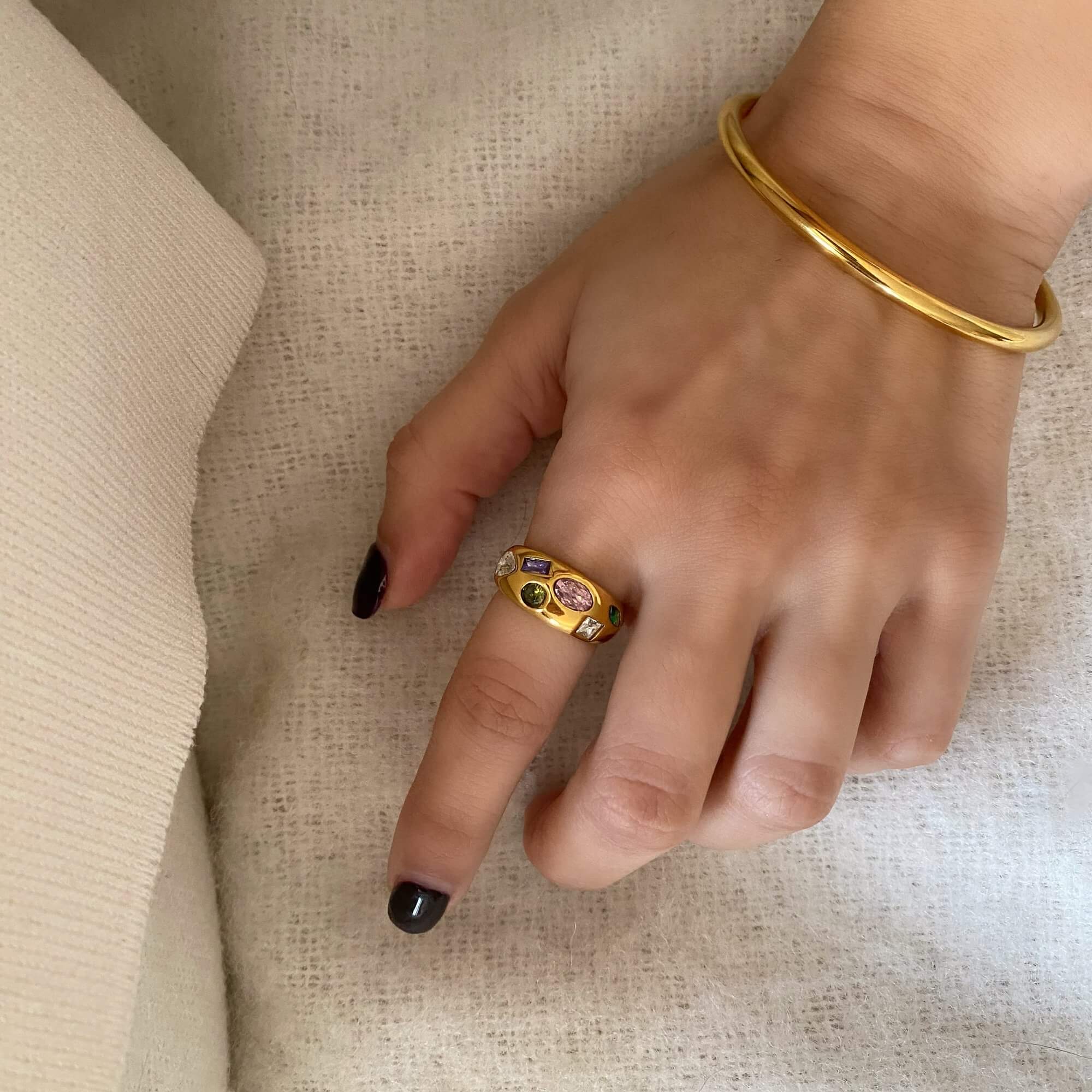 The KemmaR 18K gold-plated gemstone dome ring by Kampy Designs, worn on a hand to display its fit and refined design.