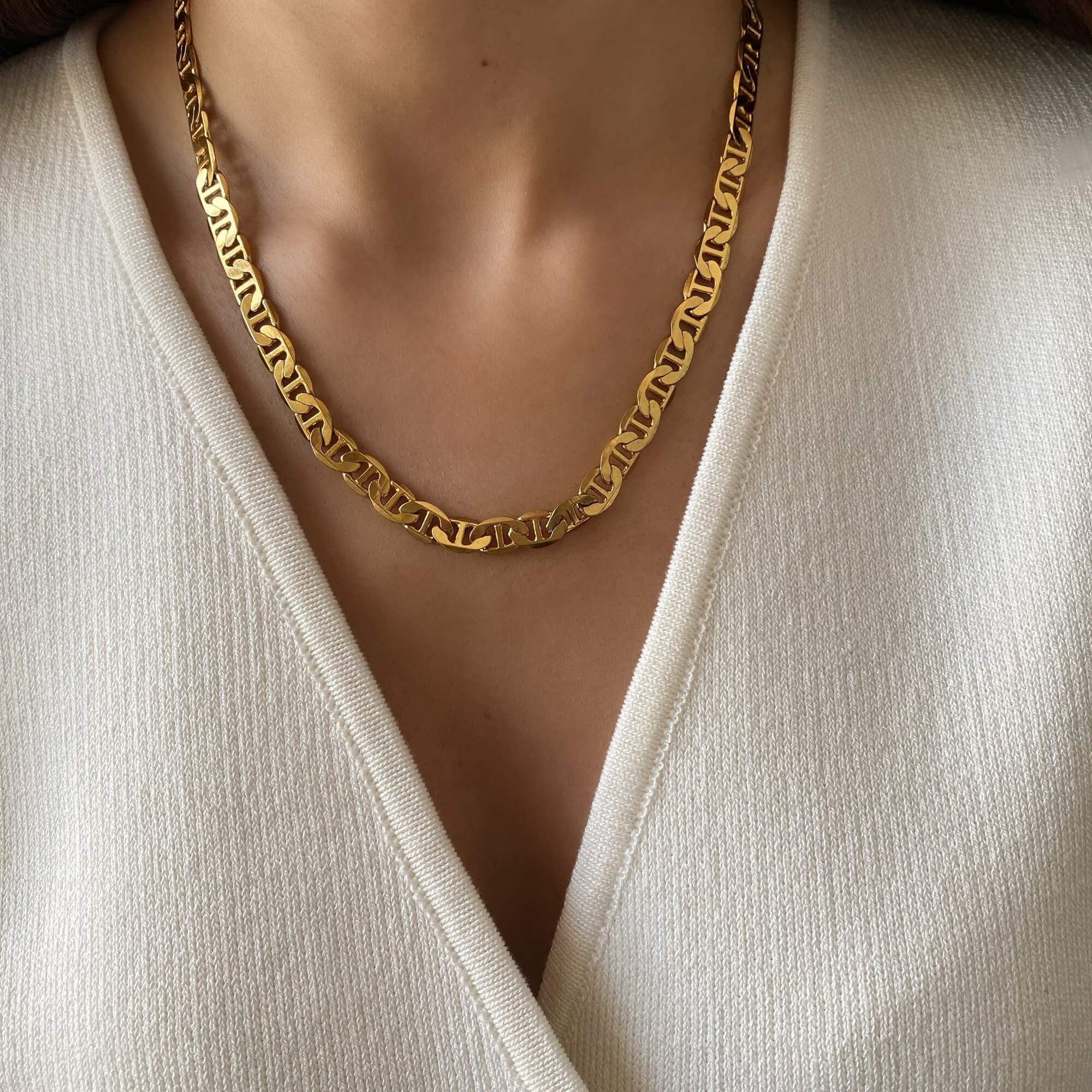 The KastielN 18K gold-plated mariner chain necklace by Kampy Designs, styled to showcase its bold and luxurious design.