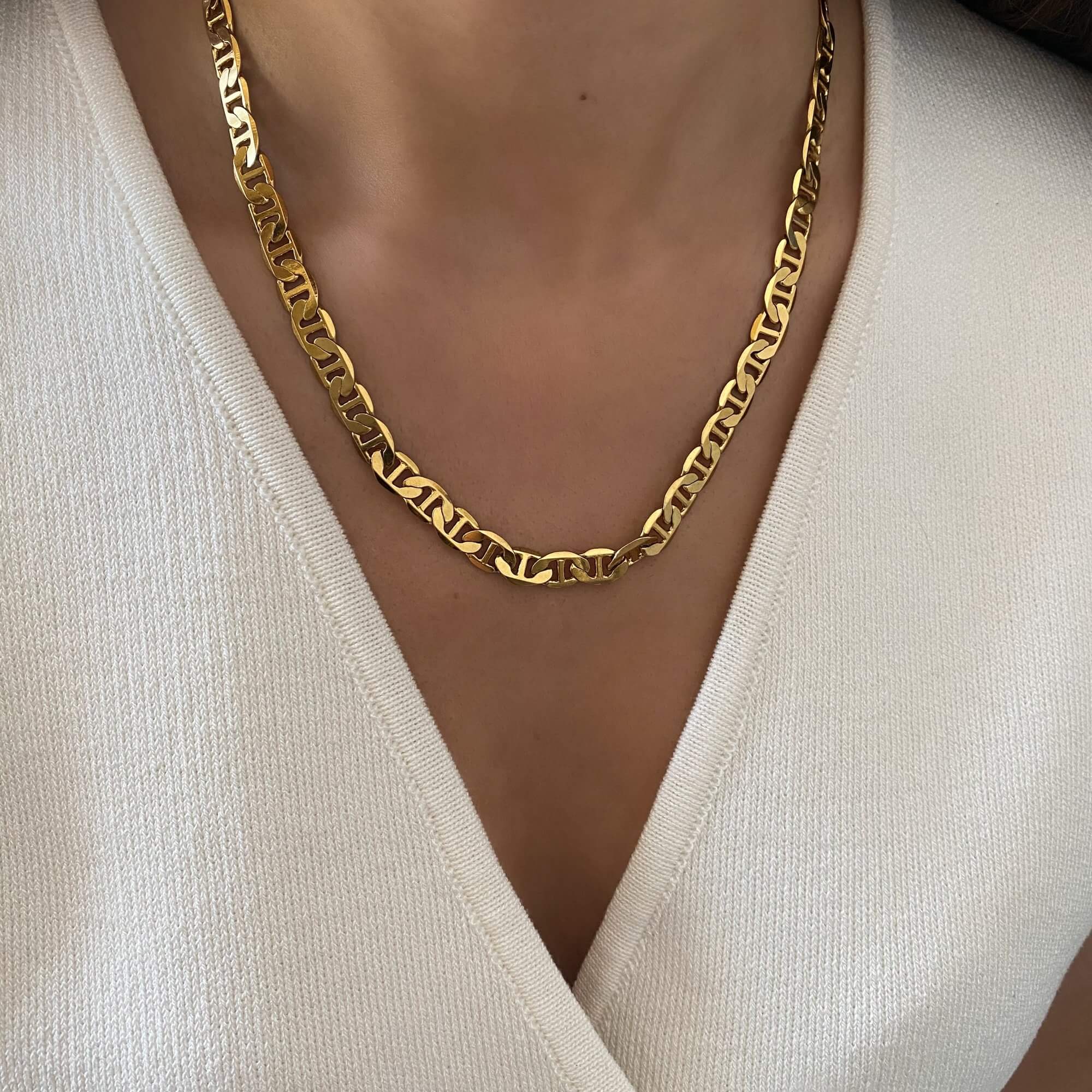 The KastielN 18K gold-plated mariner chain necklace by Kampy Designs, elegantly worn to emphasize its bold yet sophisticated appeal.