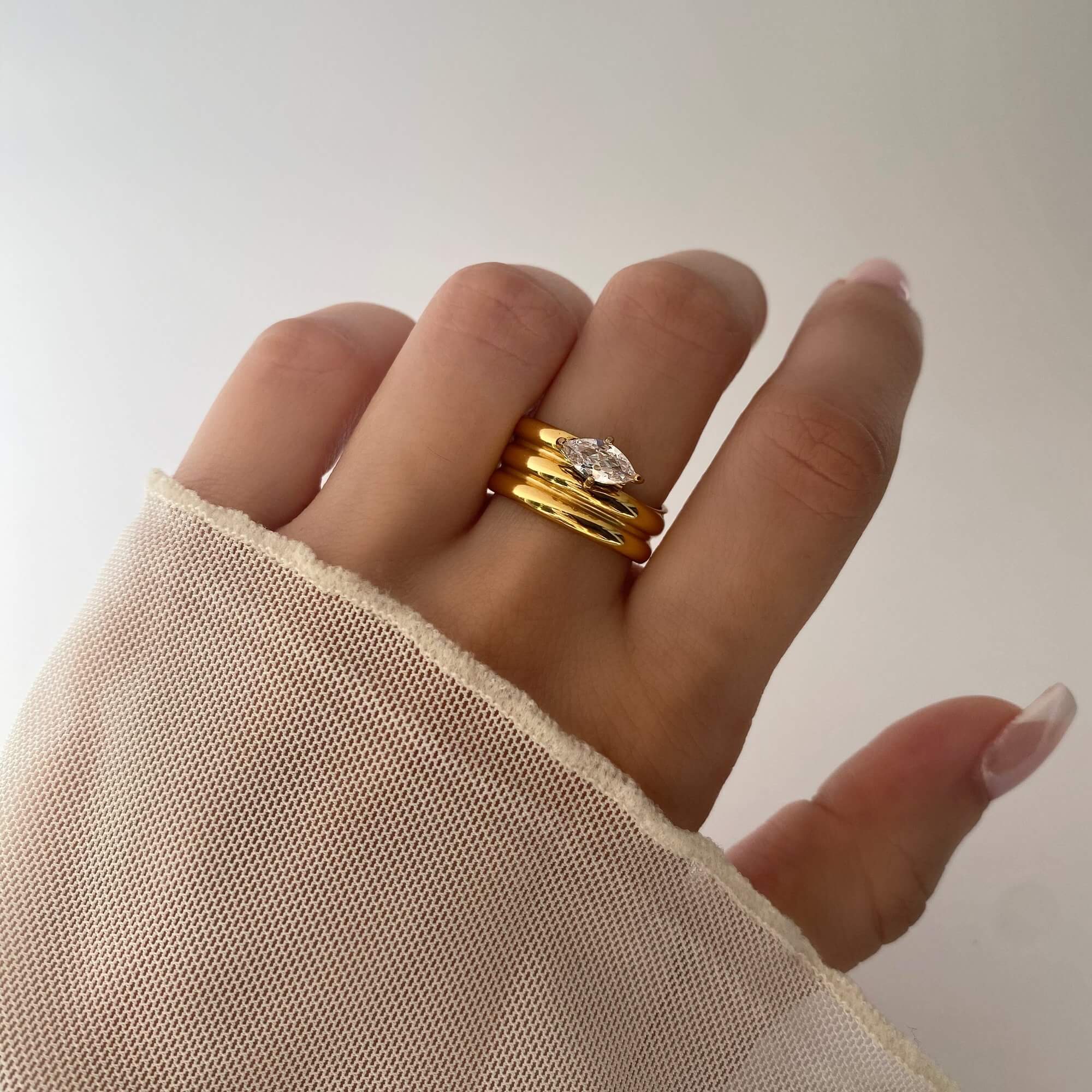 The KimchiR 18K gold-plated marquise-cut wrap ring by Kampy Designs, elegantly worn to highlight its contemporary and timeless appeal.