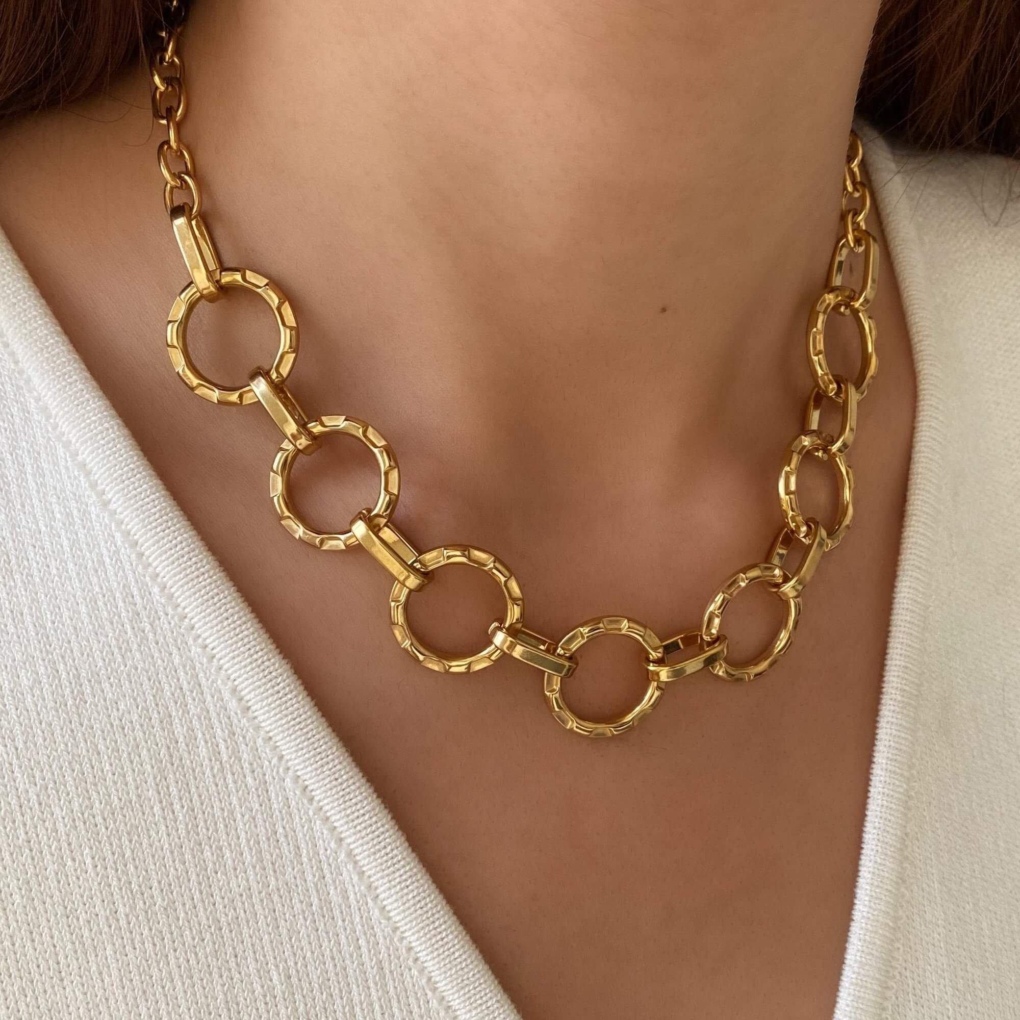 Side view of the KostyN 18K gold-plated open circle charm necklace by Kampy Designs, capturing its delicate chain and polished circle charm.