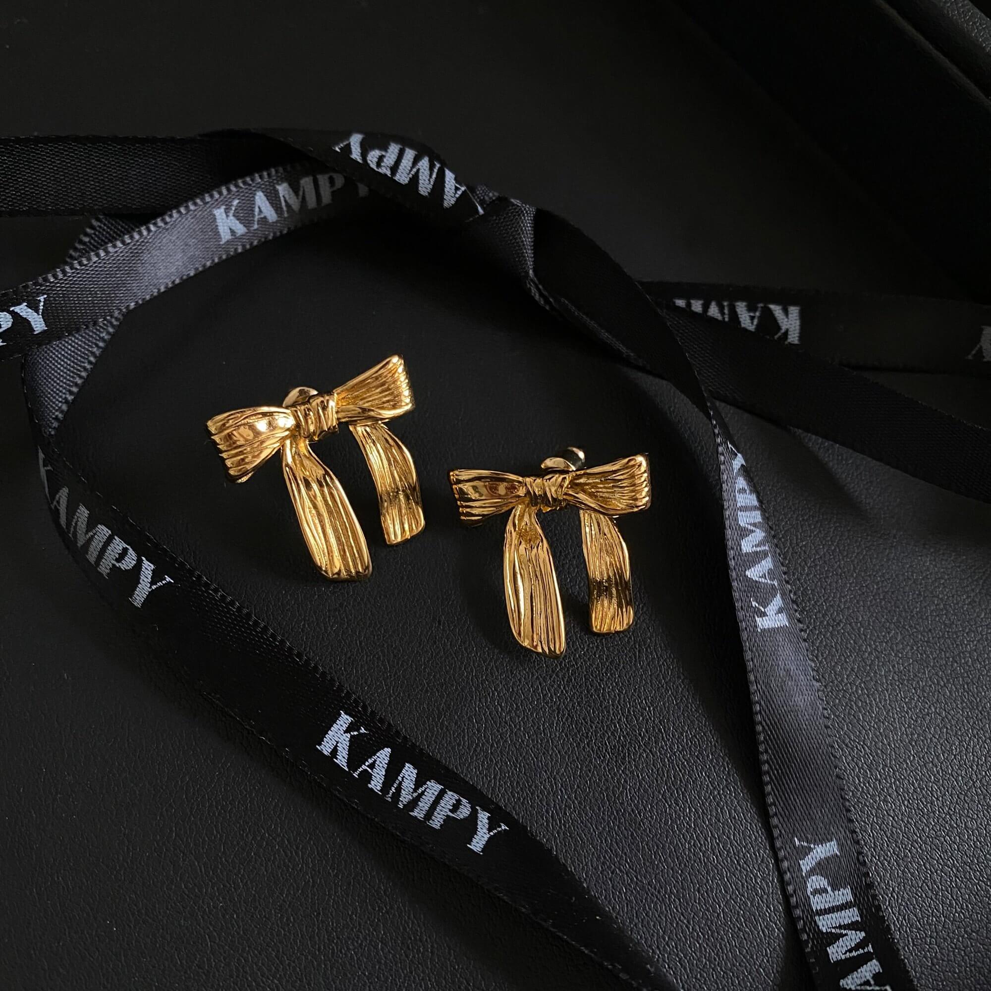 Front view of the KawlaE 18K gold-plated ribbon stud earrings by Kampy Designs, displaying their classic and sophisticated ribbon shape.