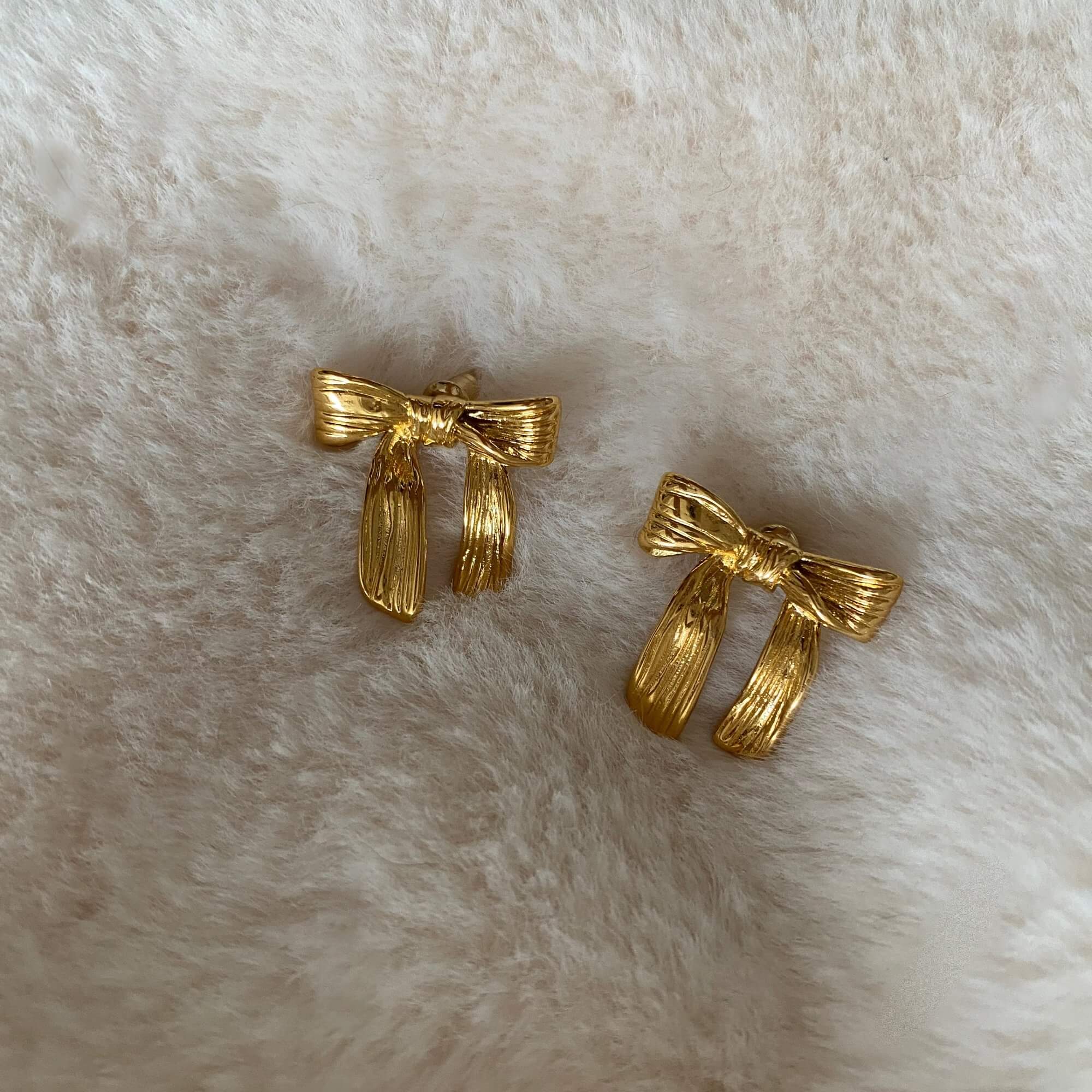 Alternative top view of the KawlaE 18K gold-plated ribbon stud earrings by Kampy Designs, capturing their intricate ribbon detailing.