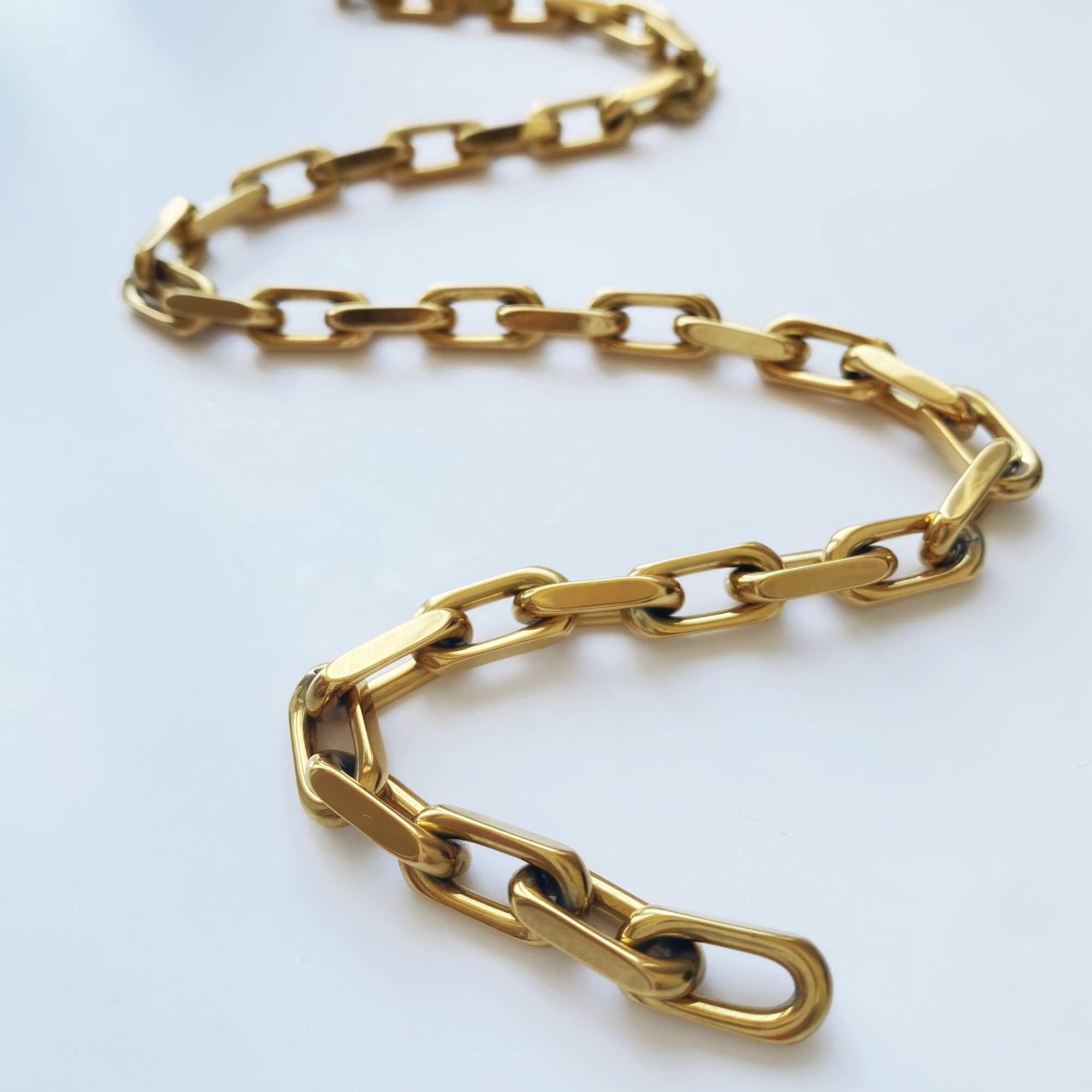 Close-up of the KlinkN 18K gold-plated thick link chain necklace by Kampy Designs, highlighting the polished gold finish and strong interlocking design.