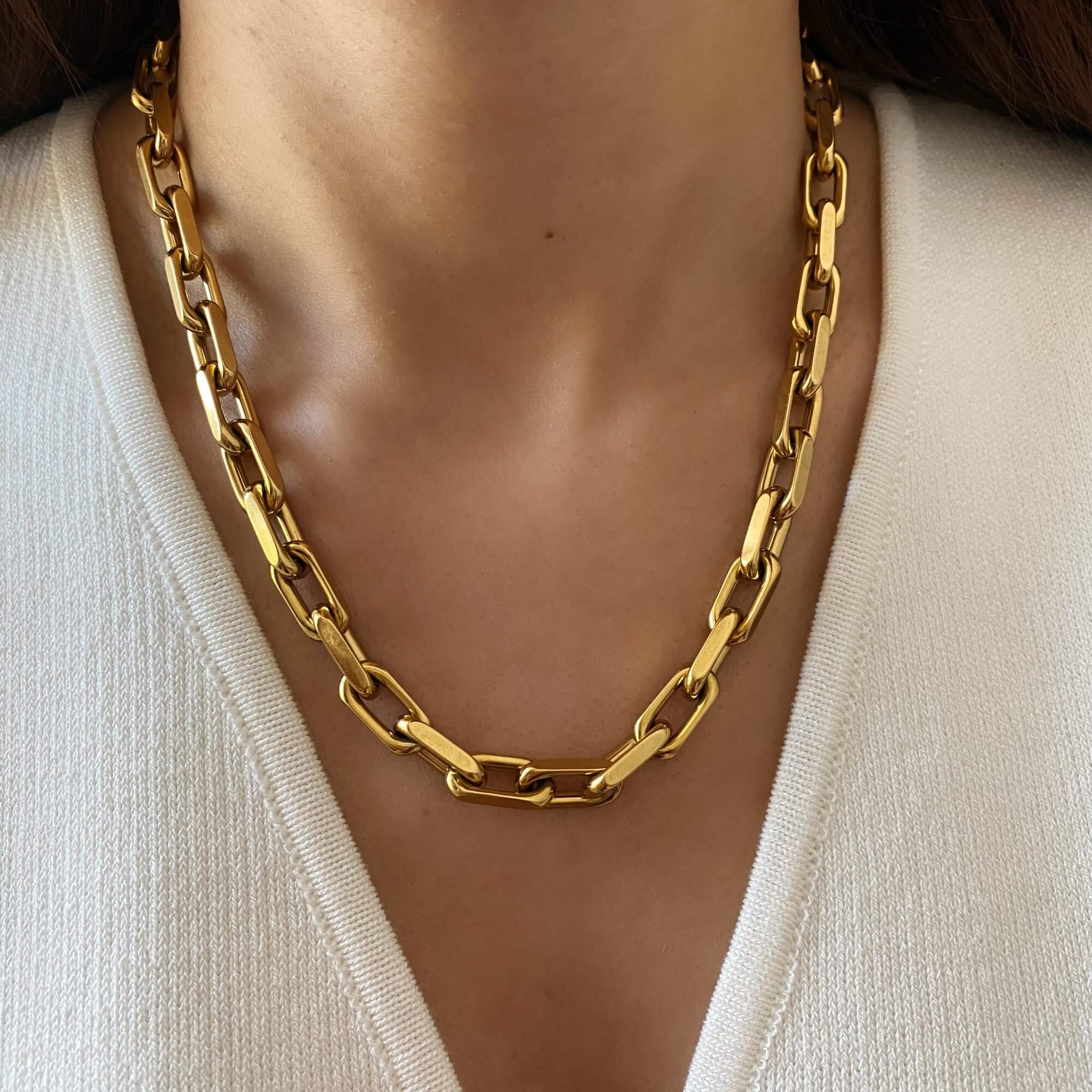 The KlinkN 18K gold-plated thick link chain necklace by Kampy Designs, elegantly worn to highlight its bold, statement-making design.