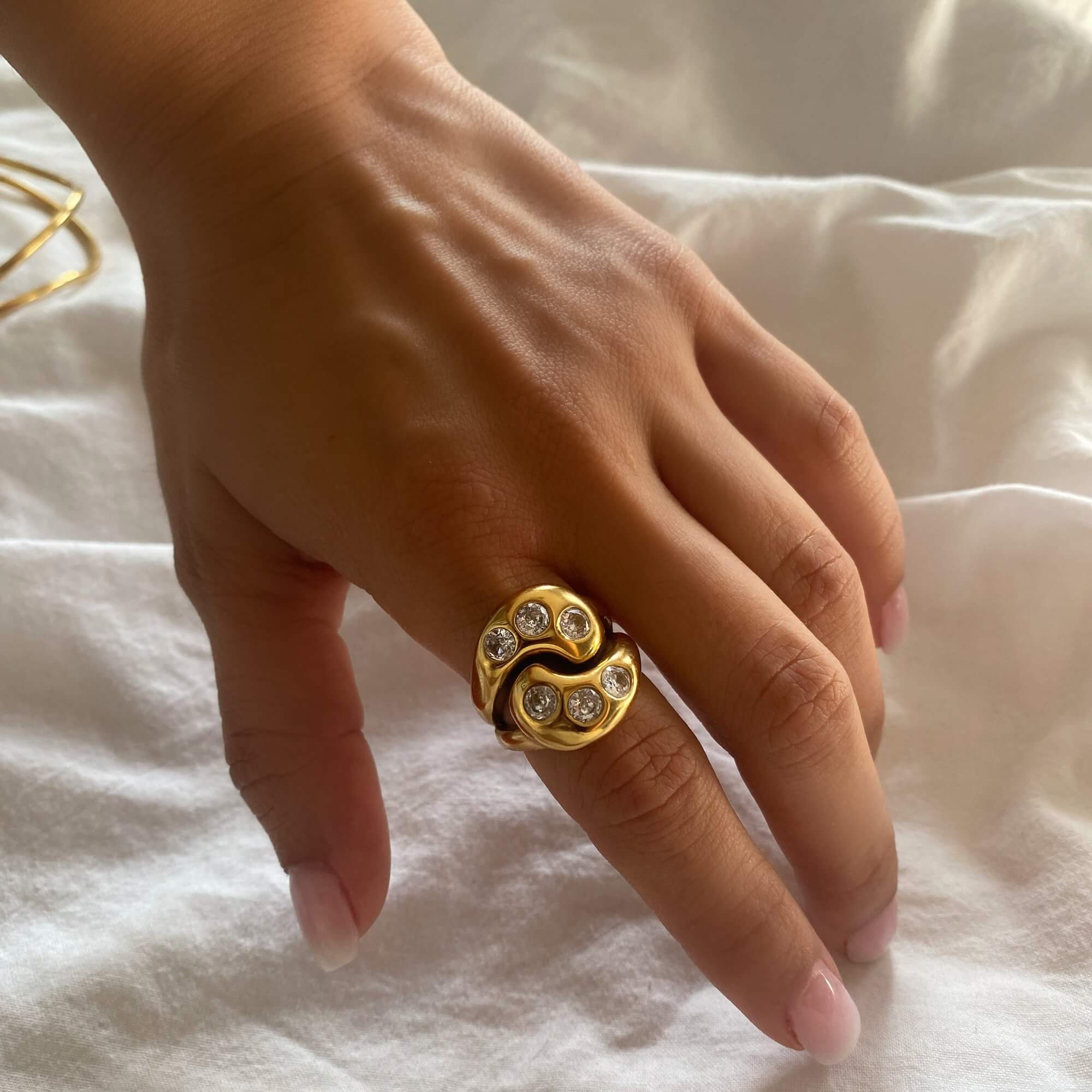 Angled view of the KassyR 18K gold-plated yin-yang CZ ring by Kampy Designs, showcasing its bold contrast and intricate cubic zirconia details.