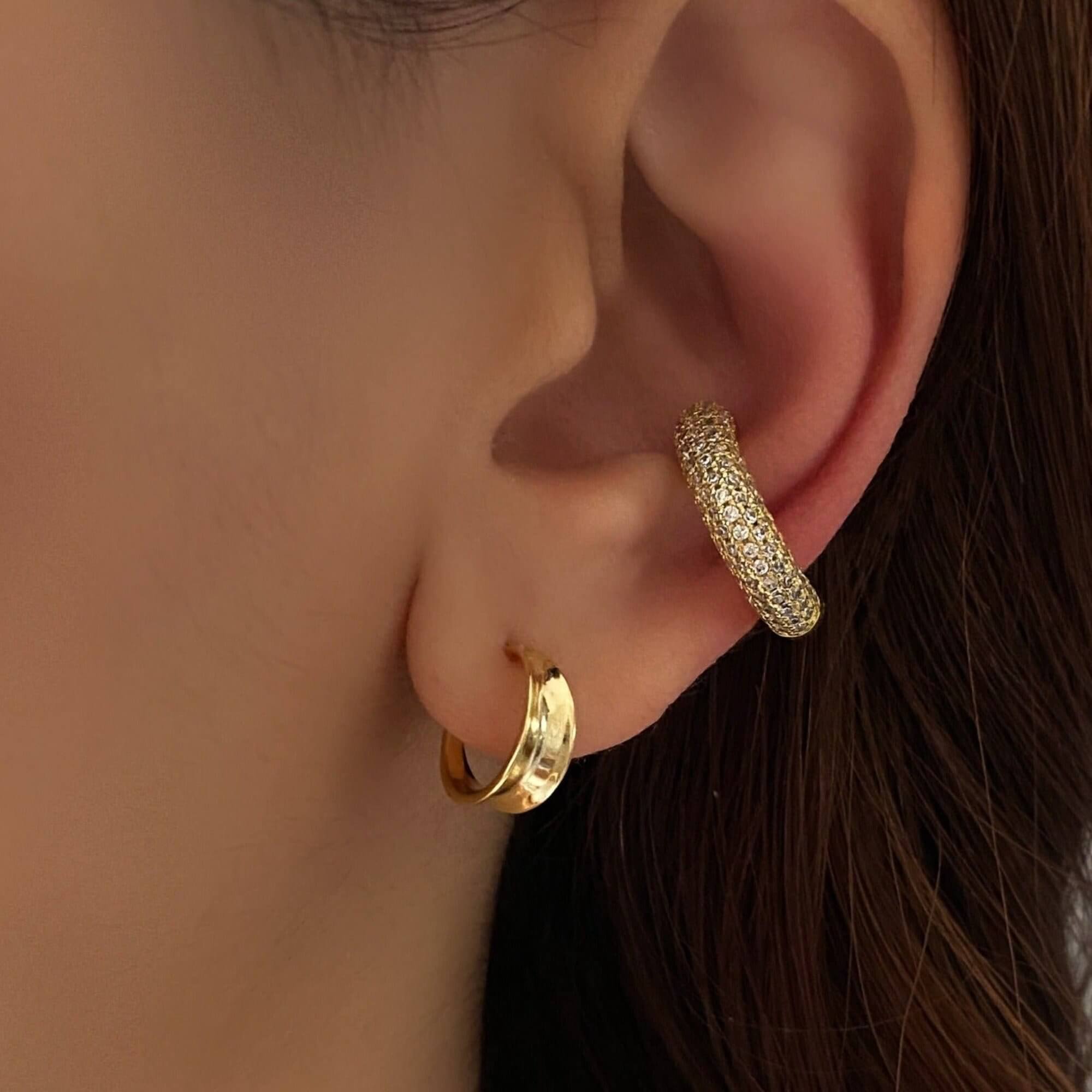 The KellyE 925 sterling silver pavé diamond cuff earrings by Kampy Designs, stylishly worn to showcase their elegant sparkle and modern cuff design.