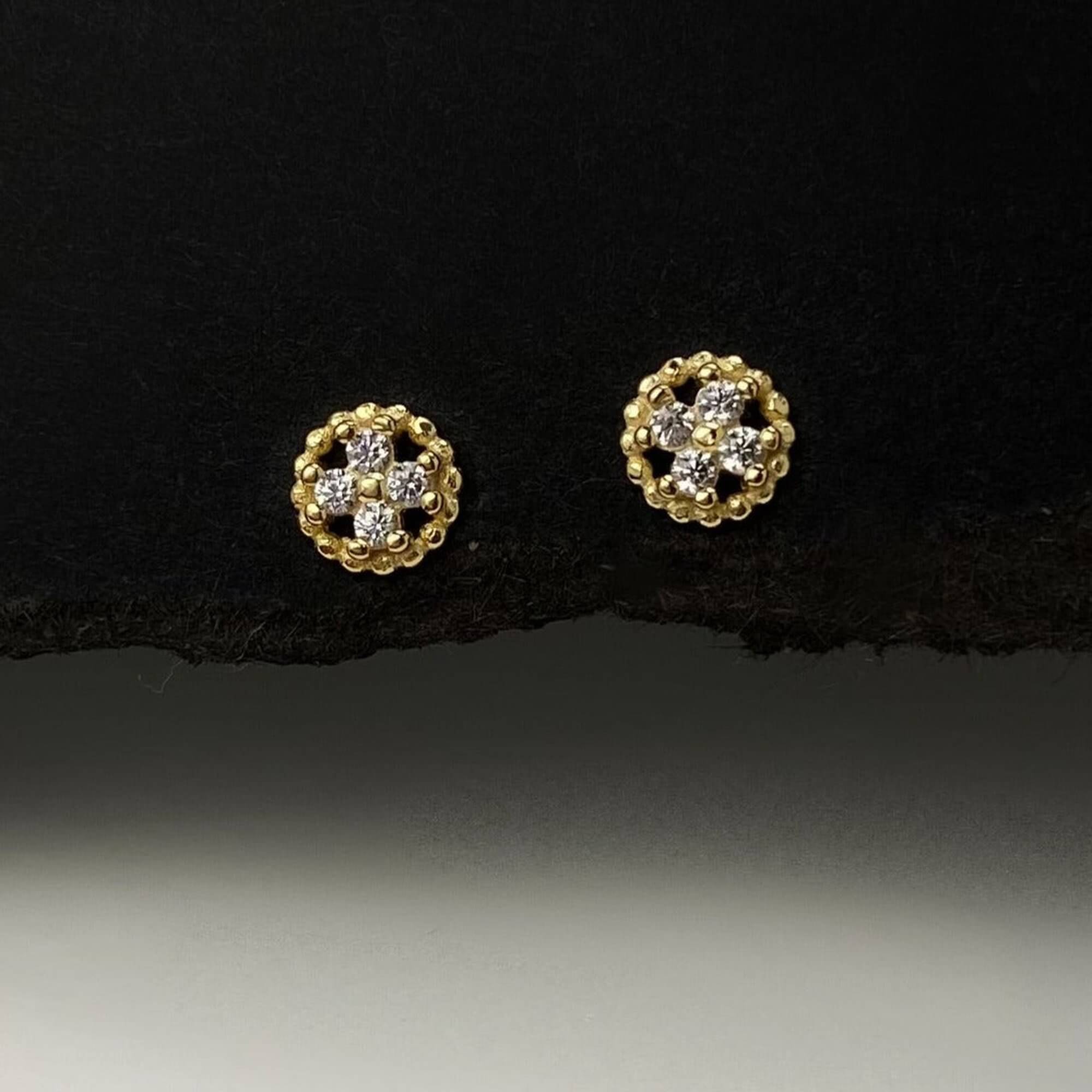 Alternate front view of the KonyE 925 sterling silver tiny clover stud earrings by Kampy Designs, displaying their polished silver finish and symmetrical shape.