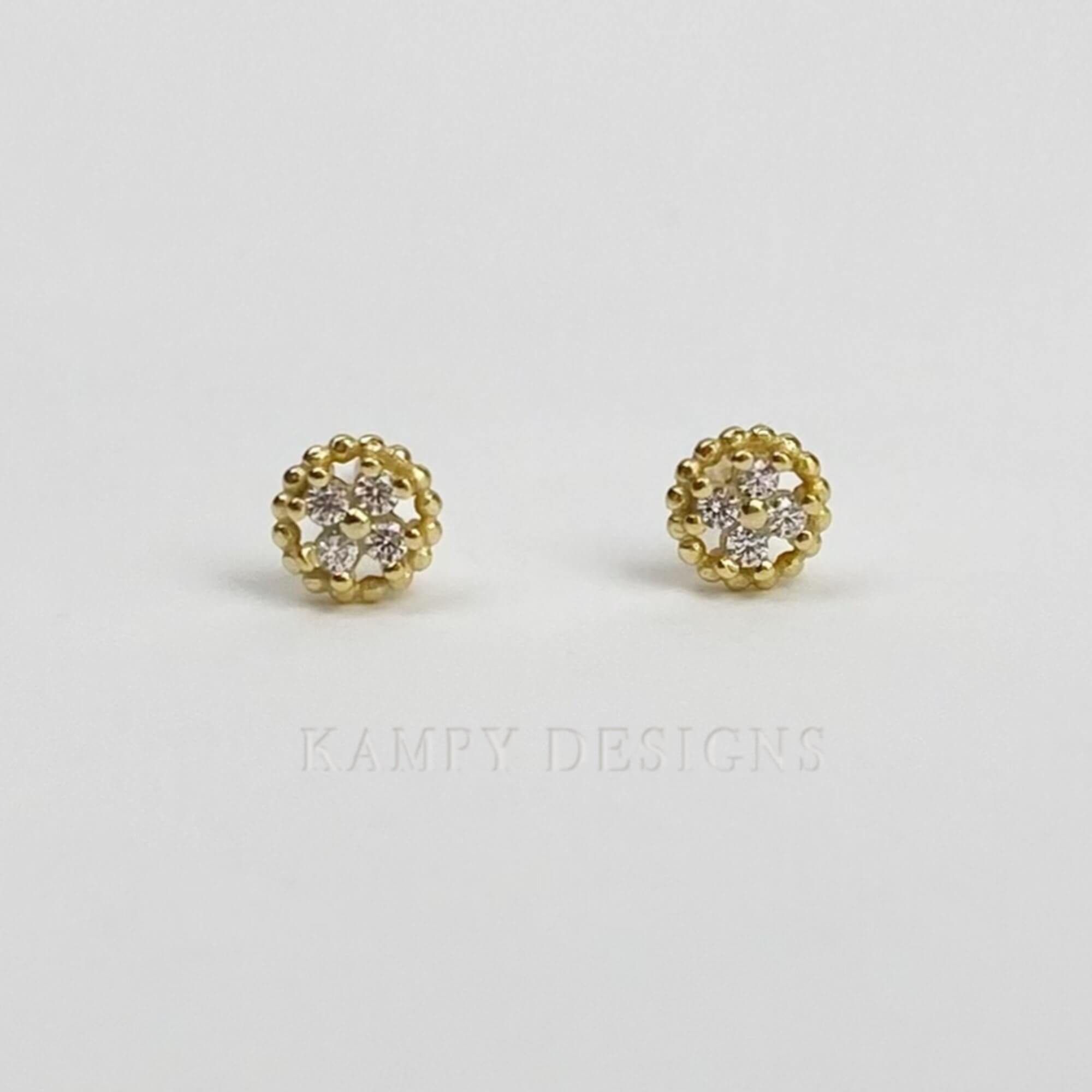 Front view of the KonyE 925 sterling silver tiny clover stud earrings by Kampy Designs, showcasing their elegant four-leaf clover design."