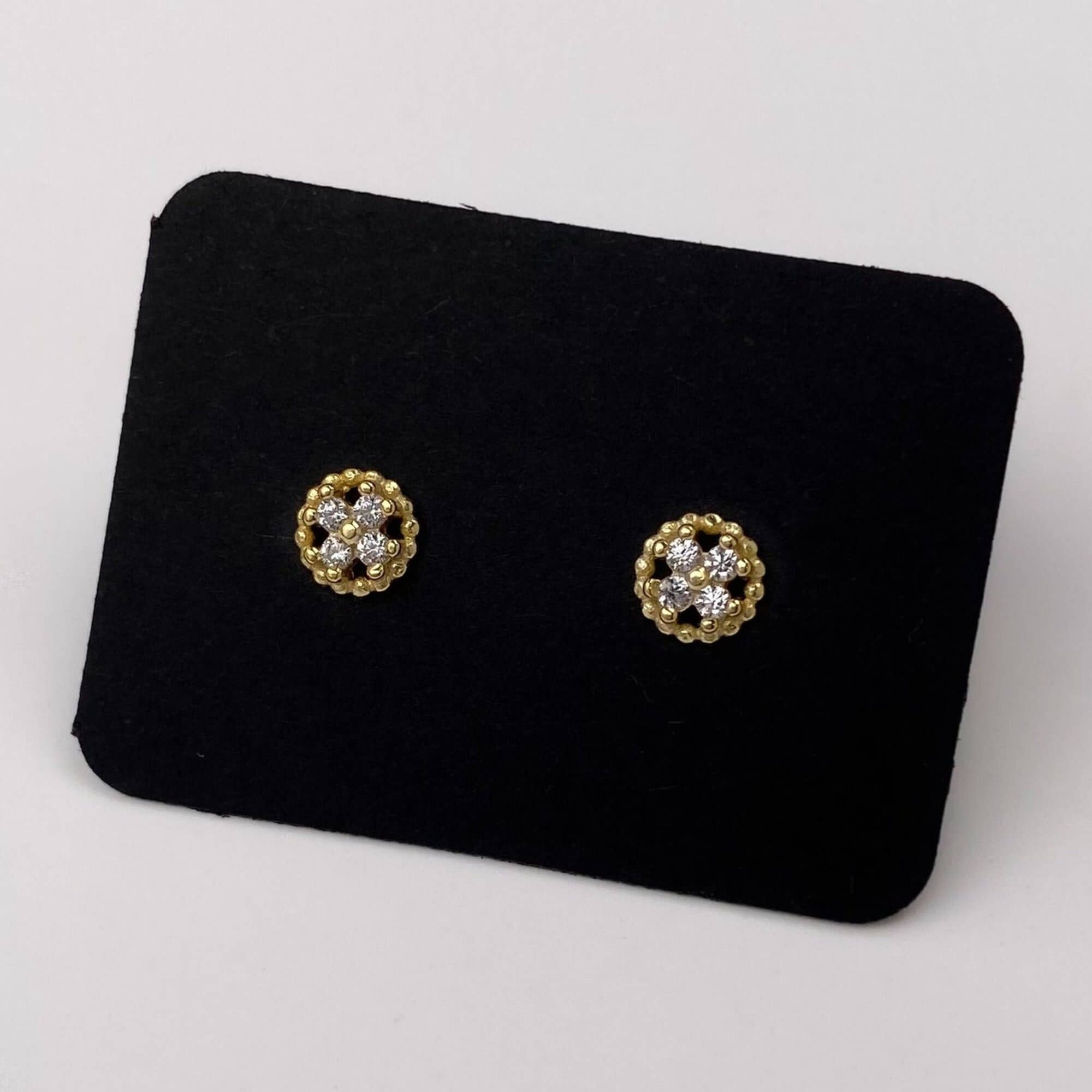 Side view of the KonyE 925 sterling silver tiny clover stud earrings by Kampy Designs, highlighting their sleek and lightweight design.