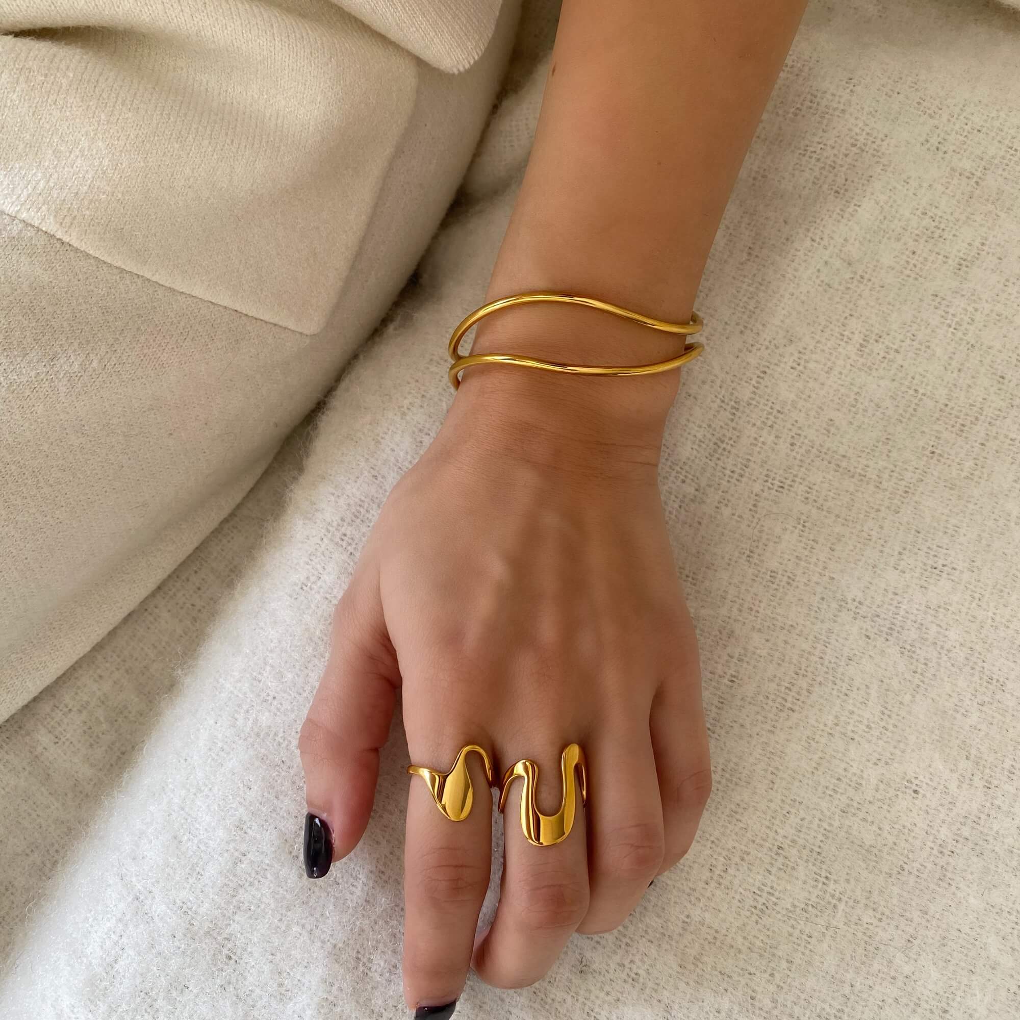 The Abstract Liquid Metal Ring by Kampy Designs, worn by model to emphasize its contemporary sculptural feel and bold aesthetic.