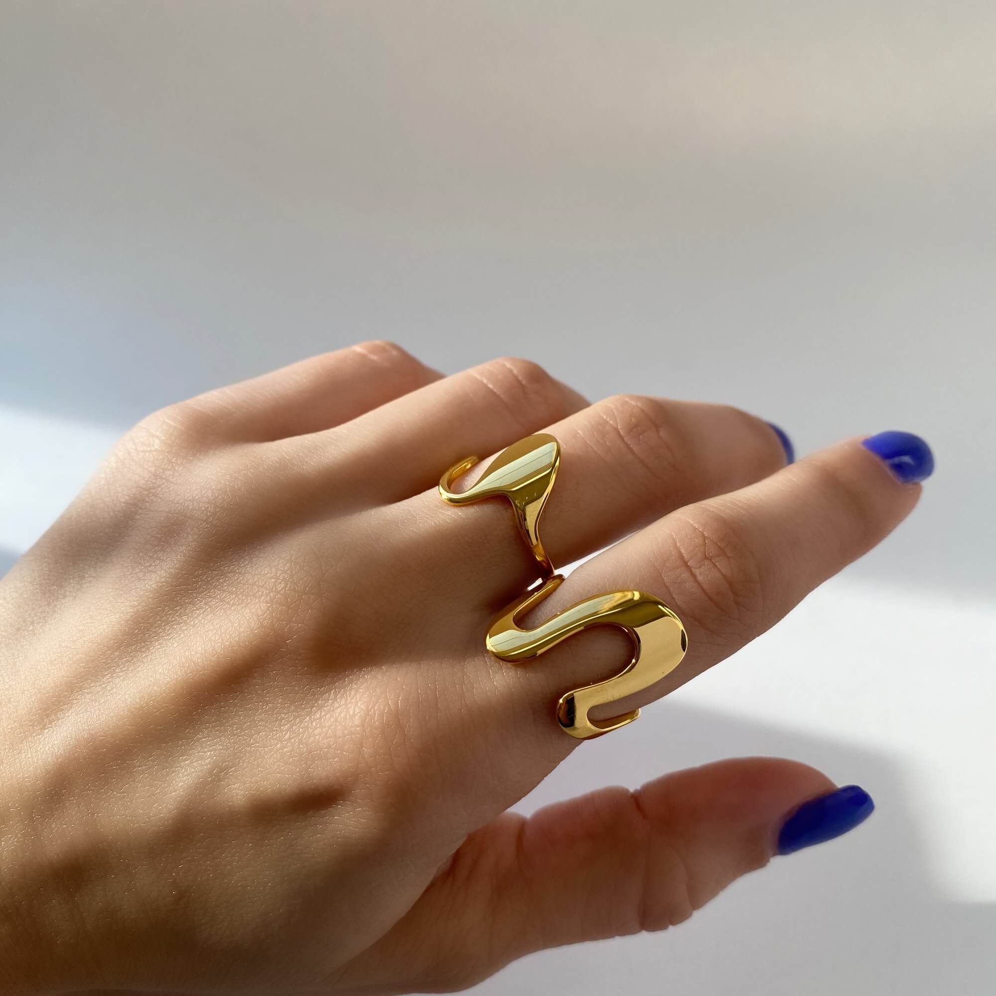 Front-facing image of the Abstract Liquid Metal Ring by Kampy Designs, revealing its dimensional, molten-metal-inspired structure.