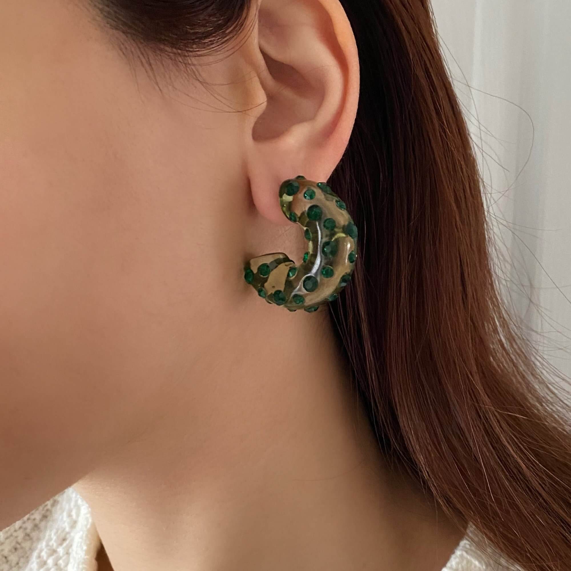 The KolorE acrylic gemstone hoop earrings by Kampy Designs, featuring a stunning green gemstone for a bold and stylish statement.