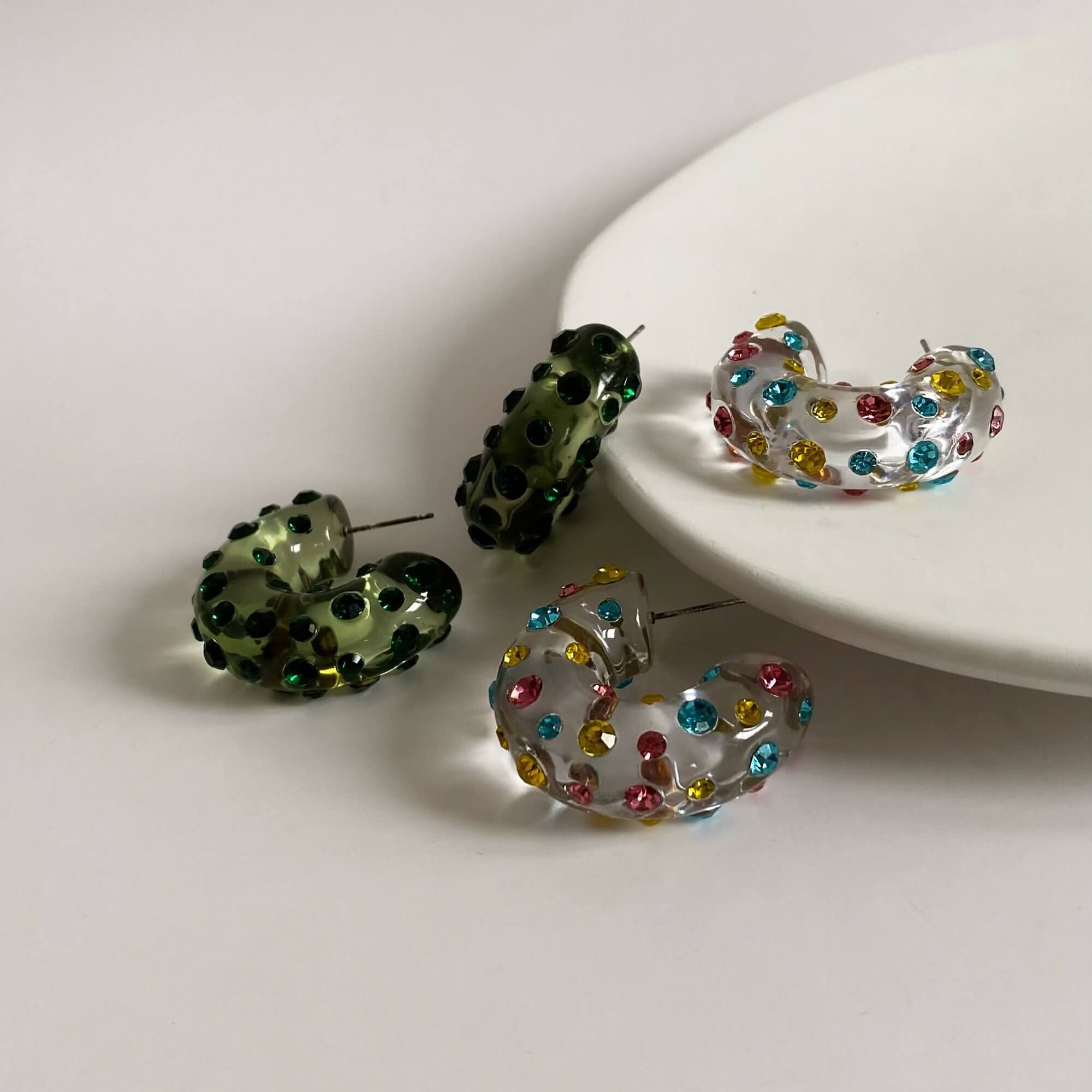 Side view of the KolorE acrylic gemstone hoop earrings by Kampy Designs, showcasing their modern silhouette and gemstone-encrusted hoop design.