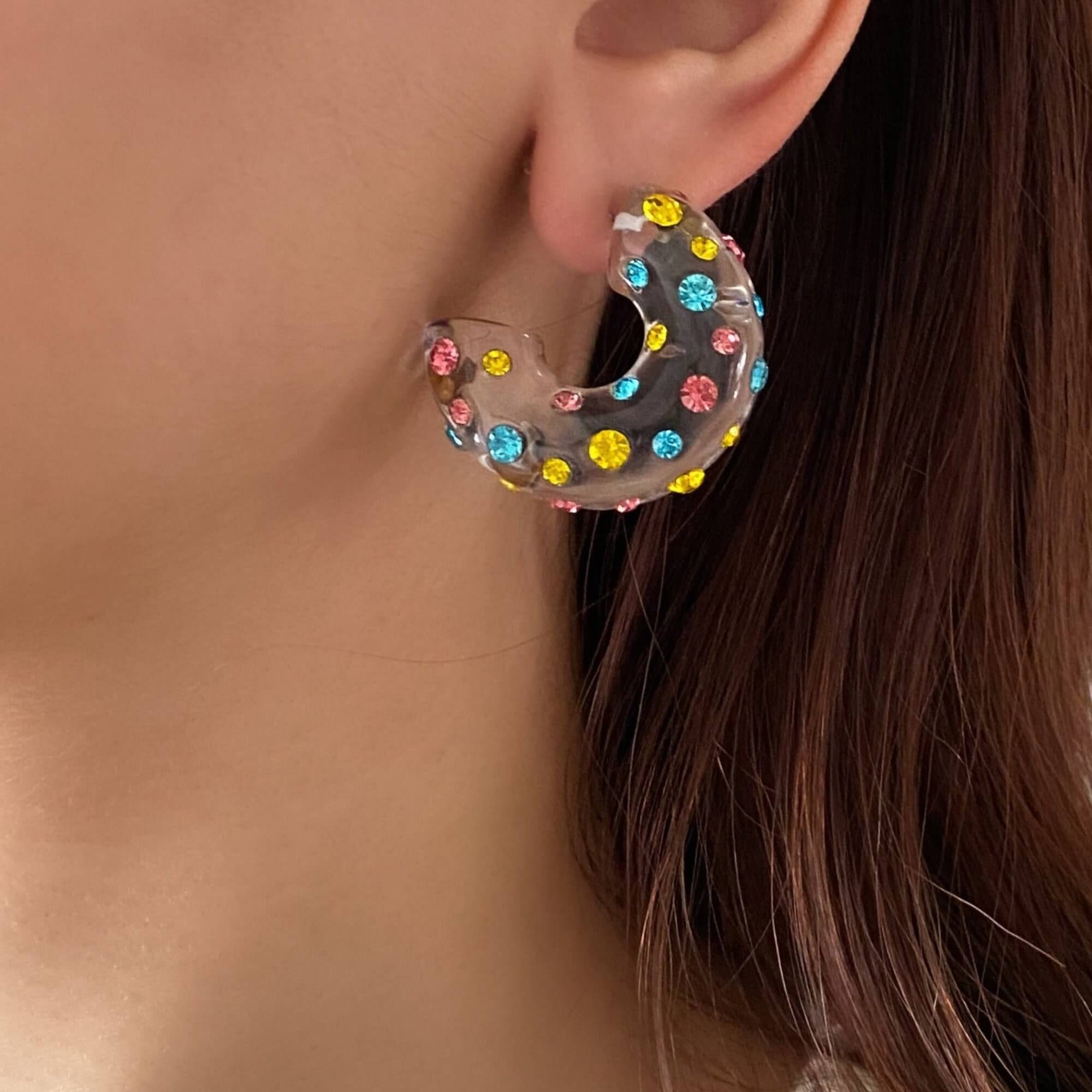 The KolorE acrylic gemstone hoop earrings by Kampy Designs, elegantly worn to showcase their vibrant gemstone accents and modern hoop design.