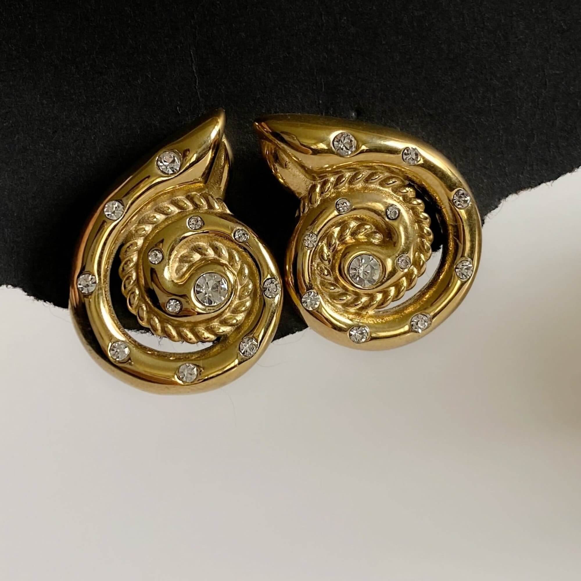 Top view of the KipsyE bold CZ seashell stud earrings by Kampy Designs, showcasing their intricate seashell shape and sparkling cubic zirconia accents.
