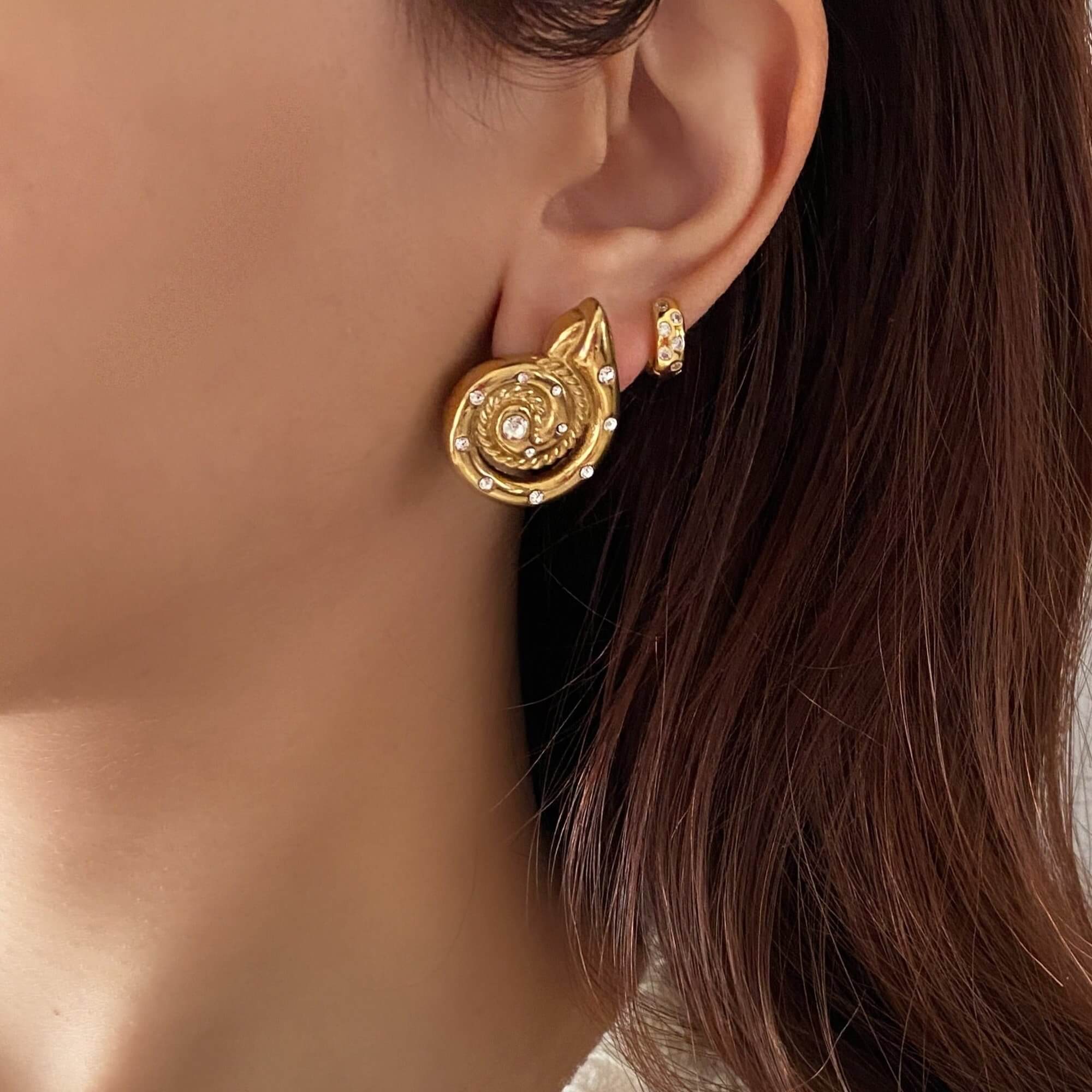 The KipsyE bold CZ seashell stud earrings by Kampy Designs, beautifully worn to highlight their ocean-inspired design and luxurious CZ embellishments.