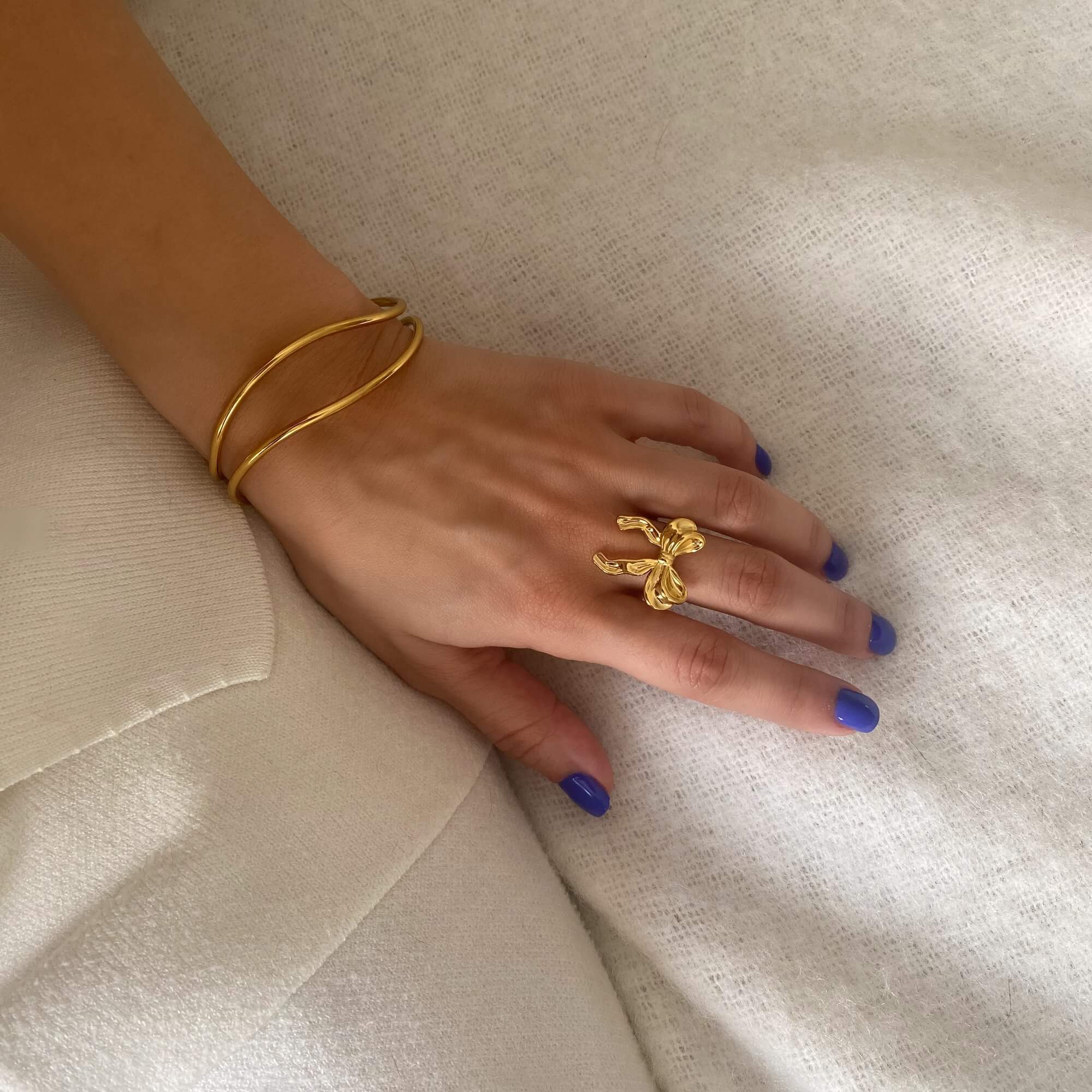 Angled view of the Kinikir bow statement ring by Kampy Designs, showcasing its dimensional bow design and bold silhouette.