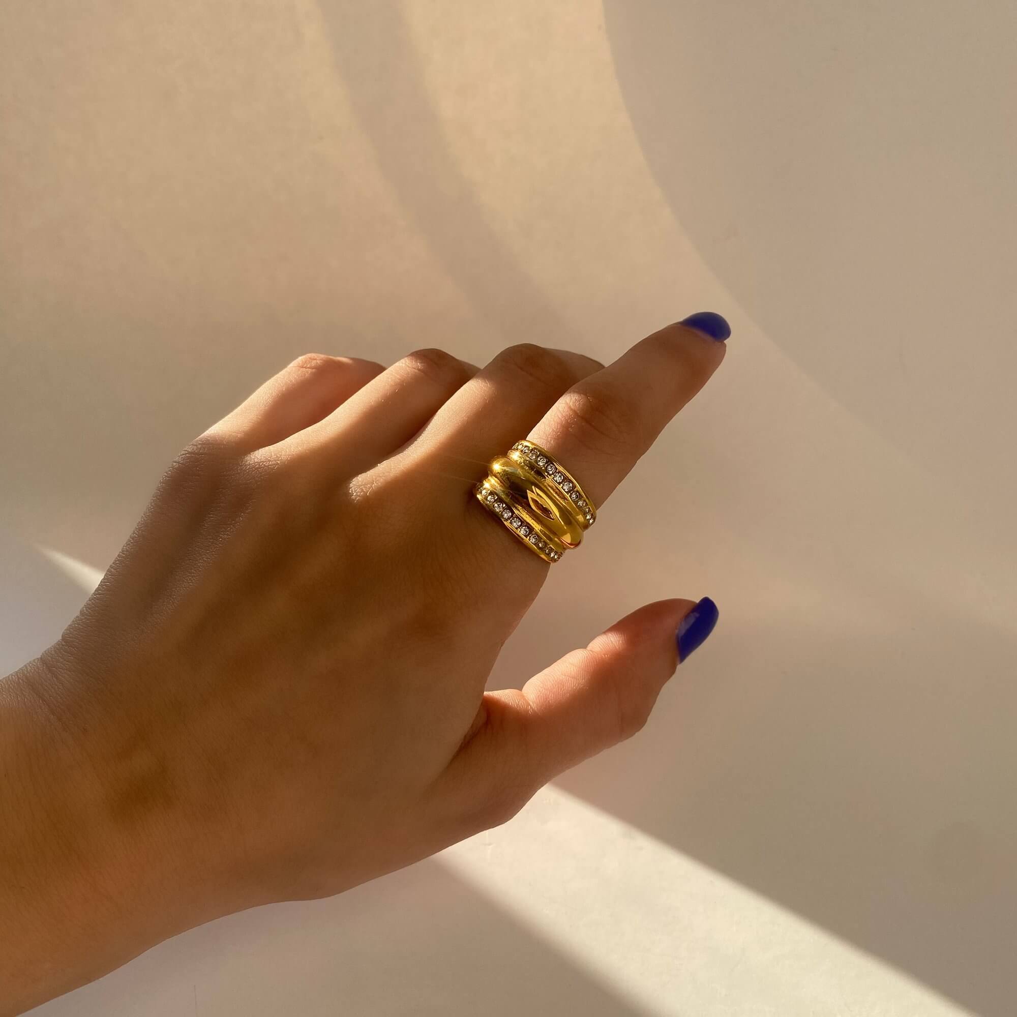 Close-up of the KatR chunky bubble ring by Kampy Designs, worn on the model’s hand to showcase its glossy texture and bold shape.