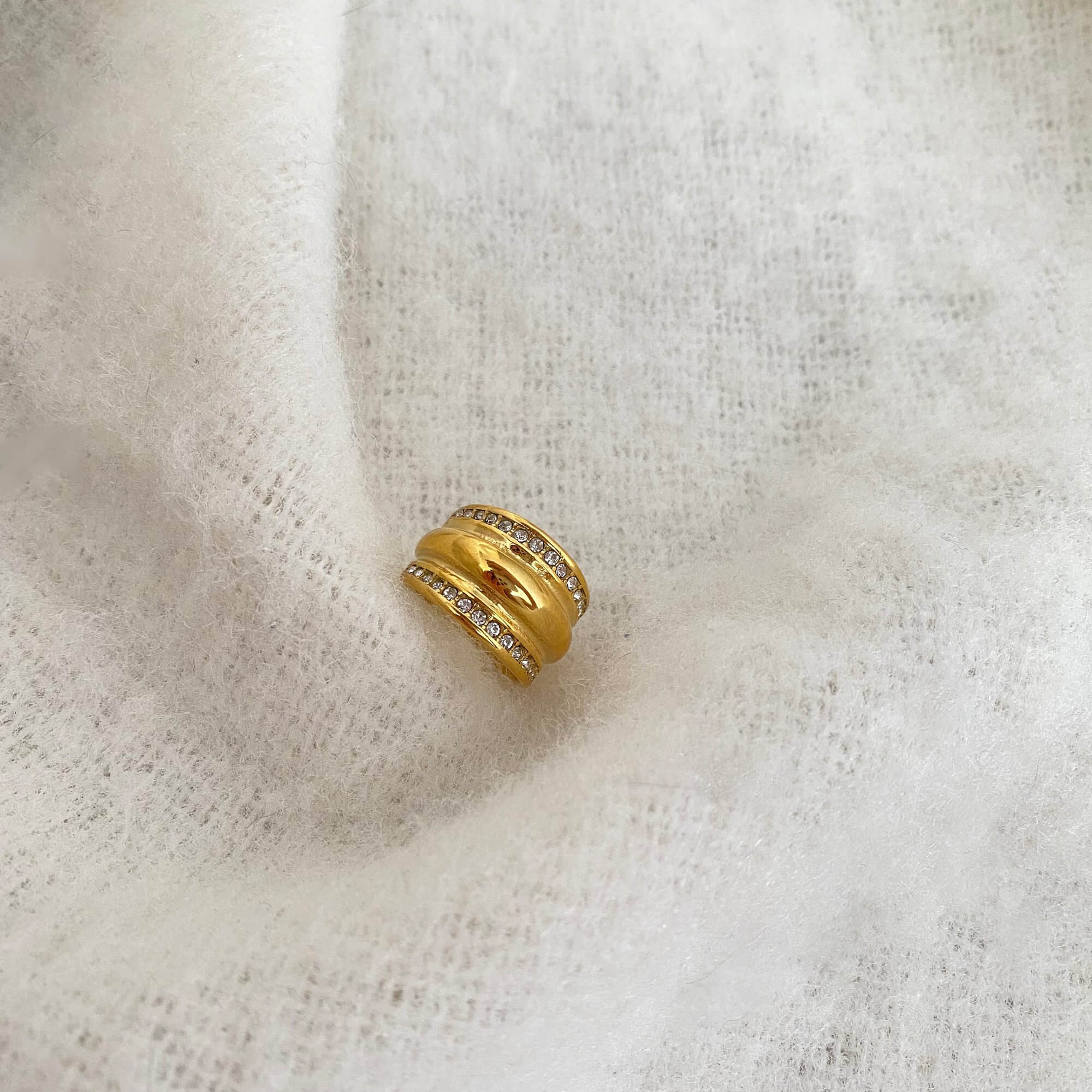 Close-up of the KatR chunky bubble ring by Kampy Designs, showcasing its playful rounded texture and mirror-like surface.