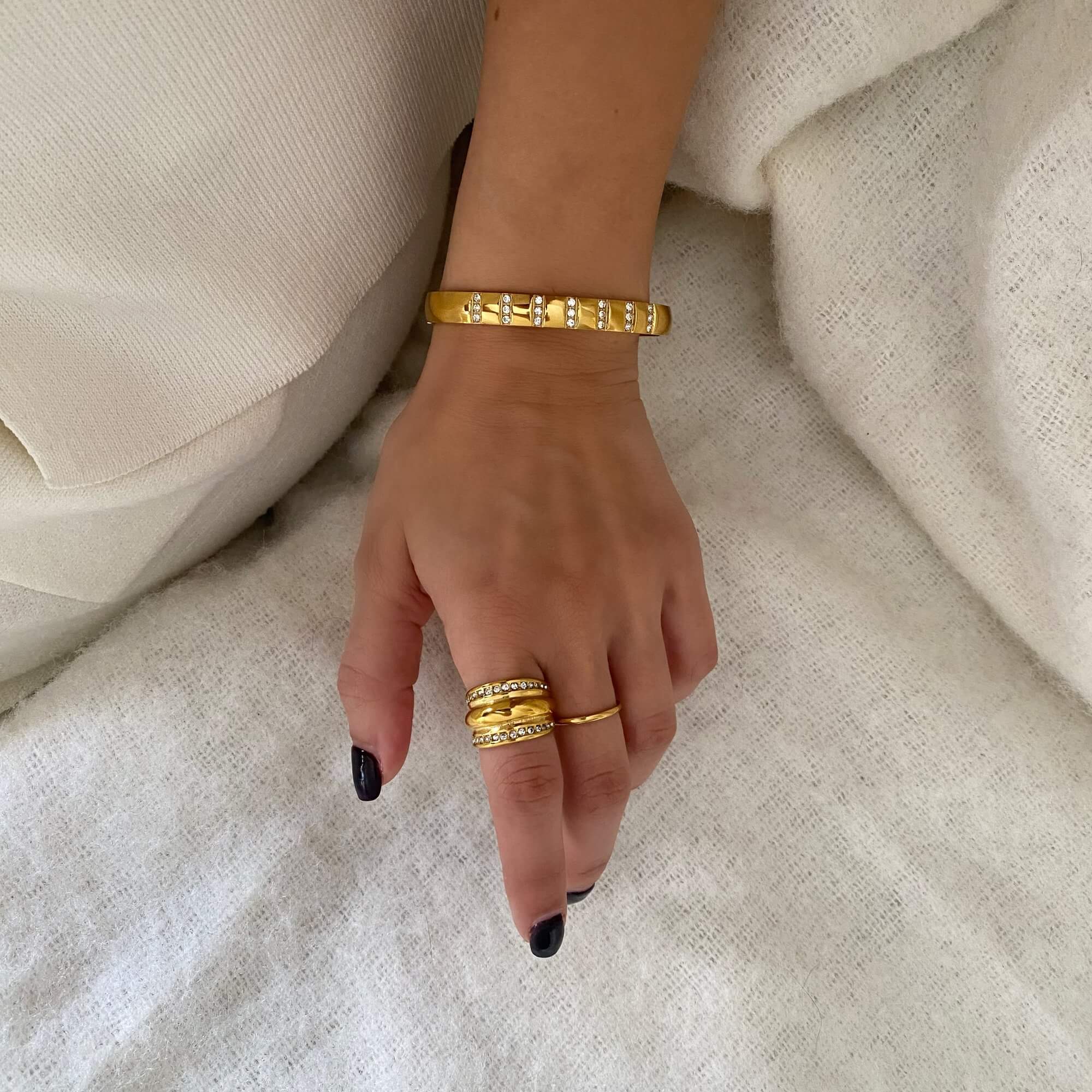 Styled image of the KatR chunky bubble ring by Kampy Designs, paired with complementary jewelry for a bold, modern look.